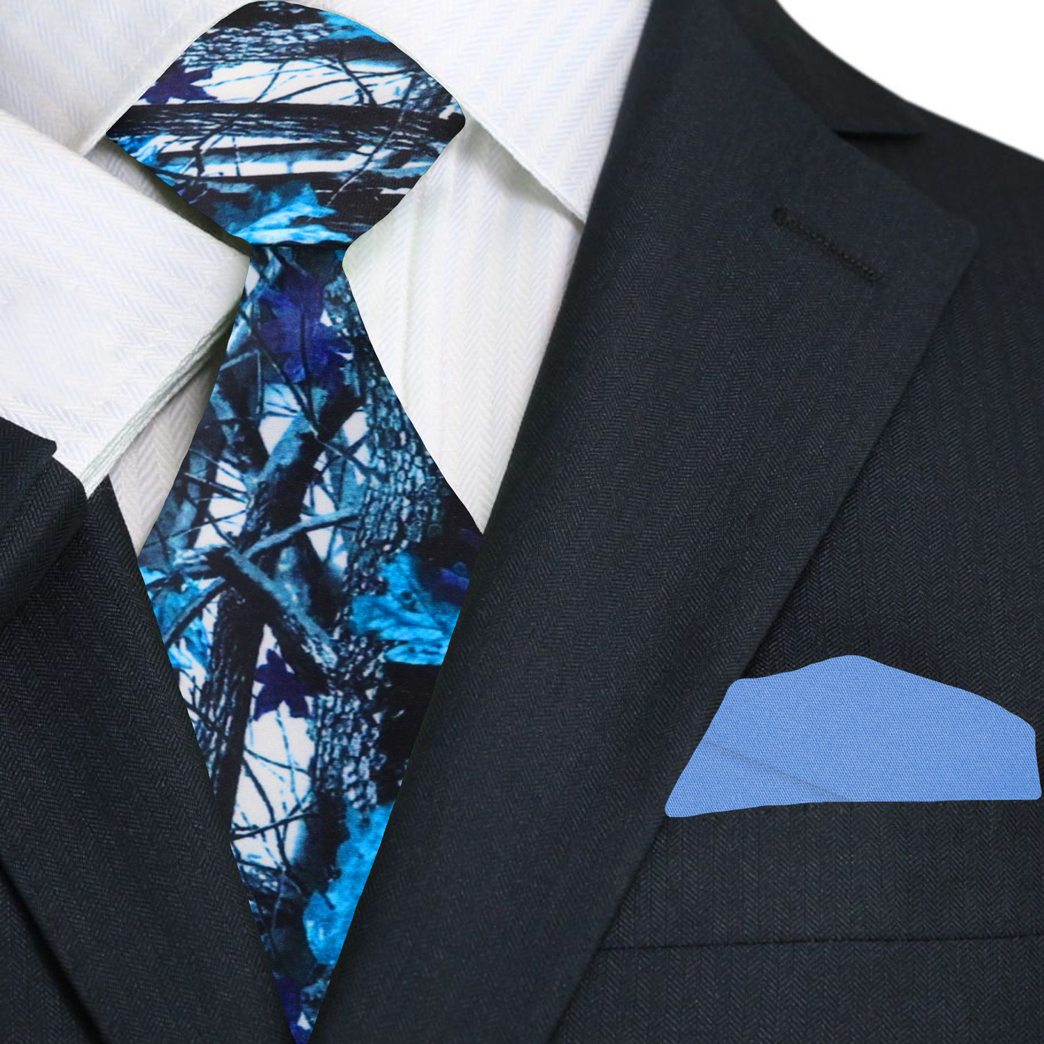 Silk camouflage tie styled with charcoal suit and pale blue shirt—ideal for stylish outdoor gatherings