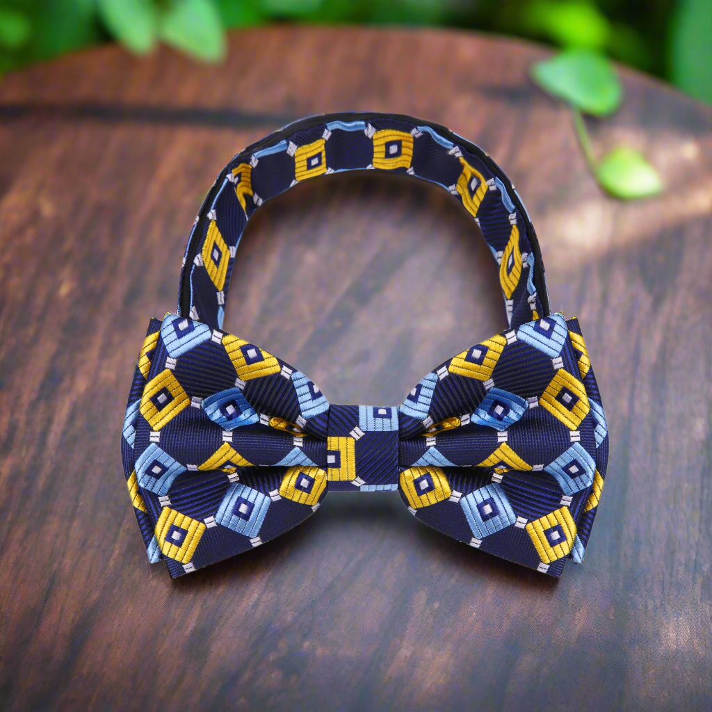 Styled outfit with geometric silk bow tie paired with a navy suit