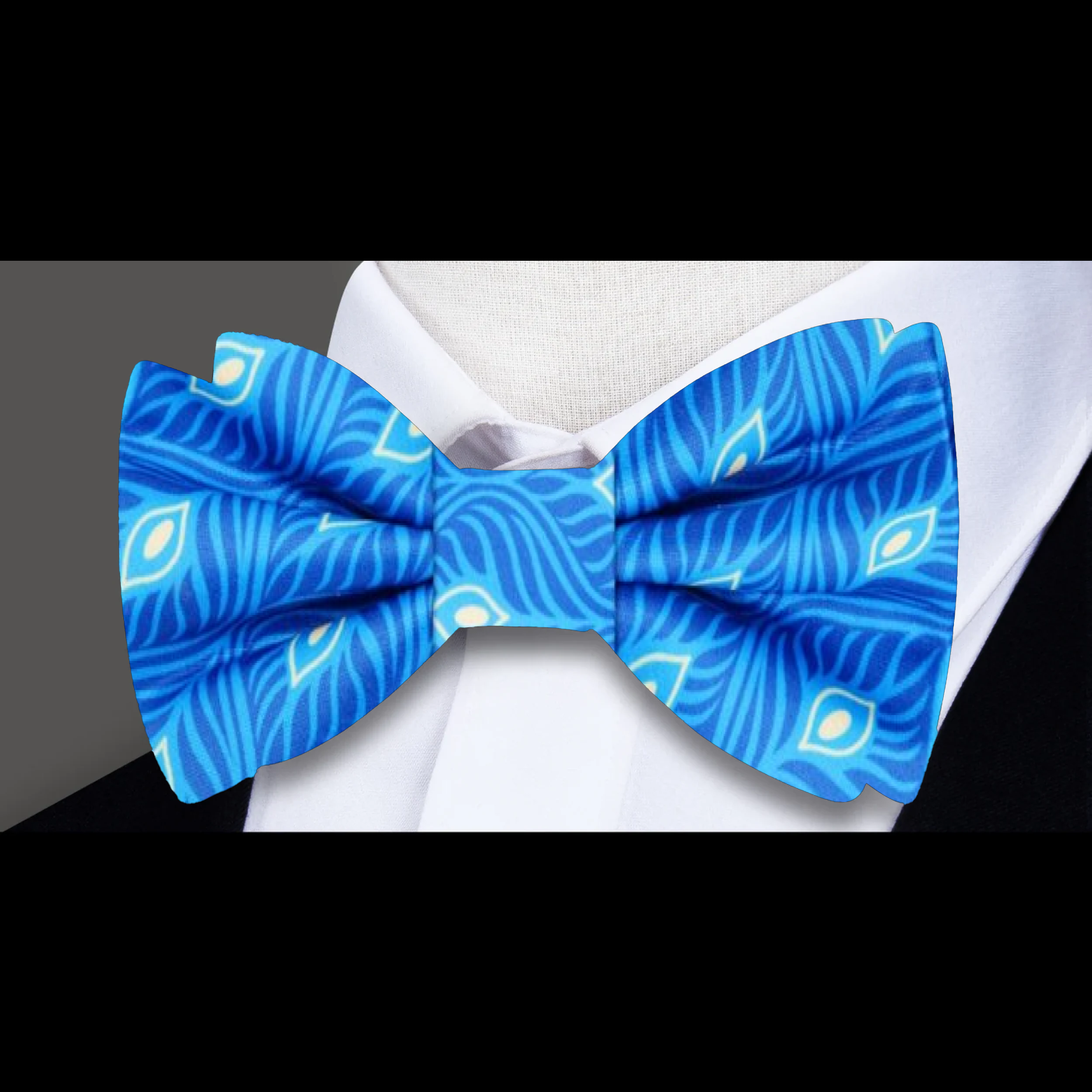 Close-up of luxury mens bow tie with feathers, showcasing intricate silk and feather details