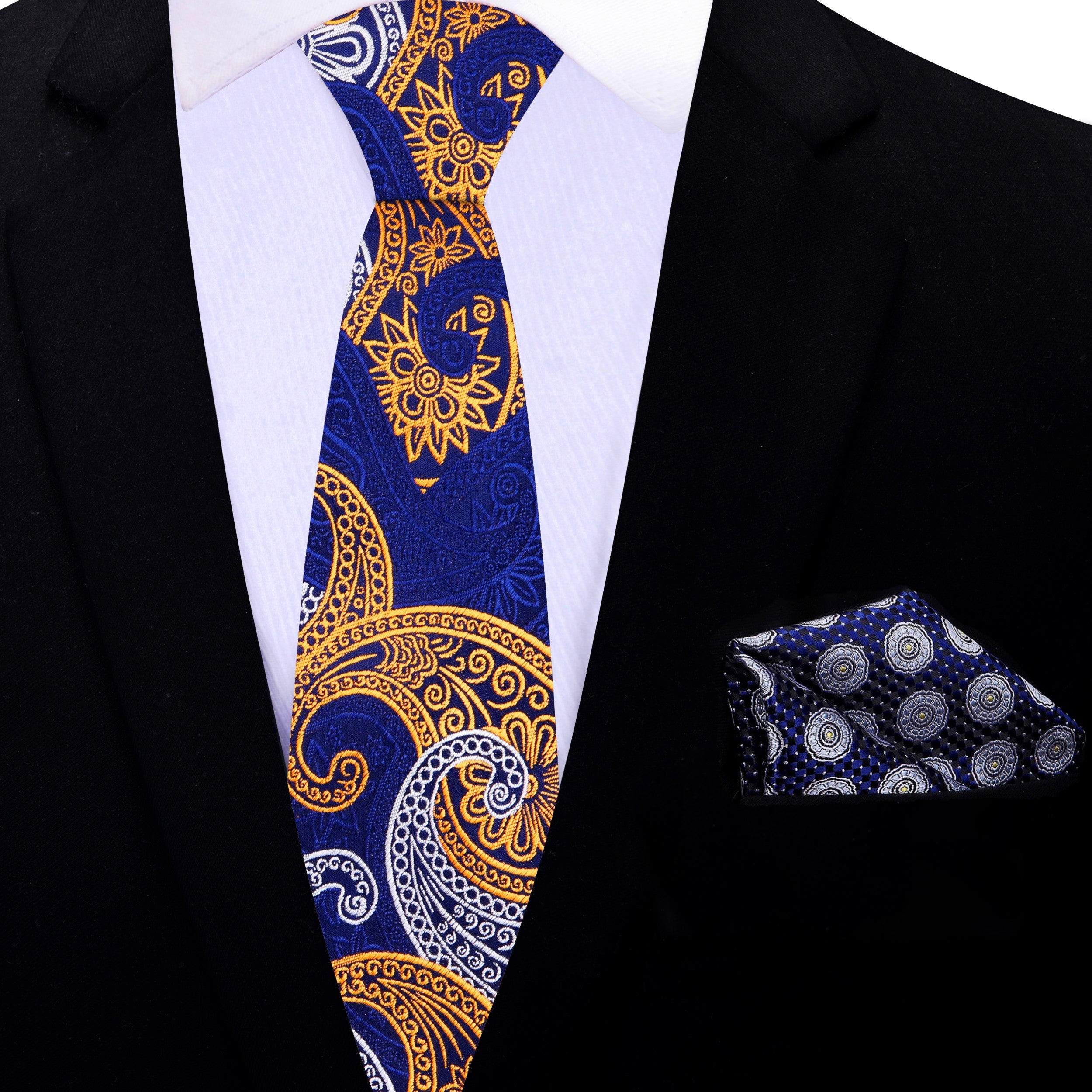 Man wearing an elegant paisley necktie paired with a crisp white shirt at a wedding