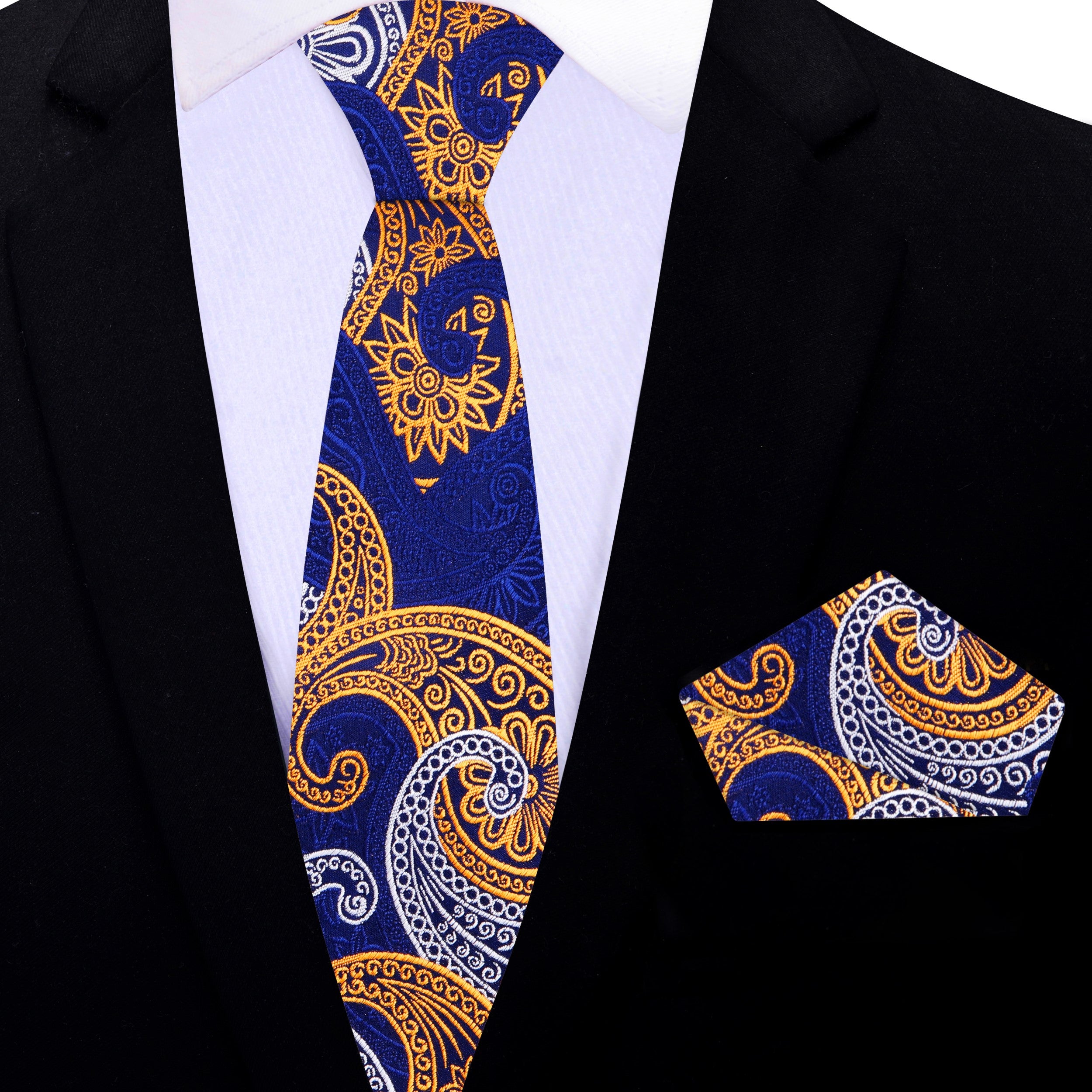 Man wearing an elegant paisley necktie paired with a crisp white shirt at a wedding