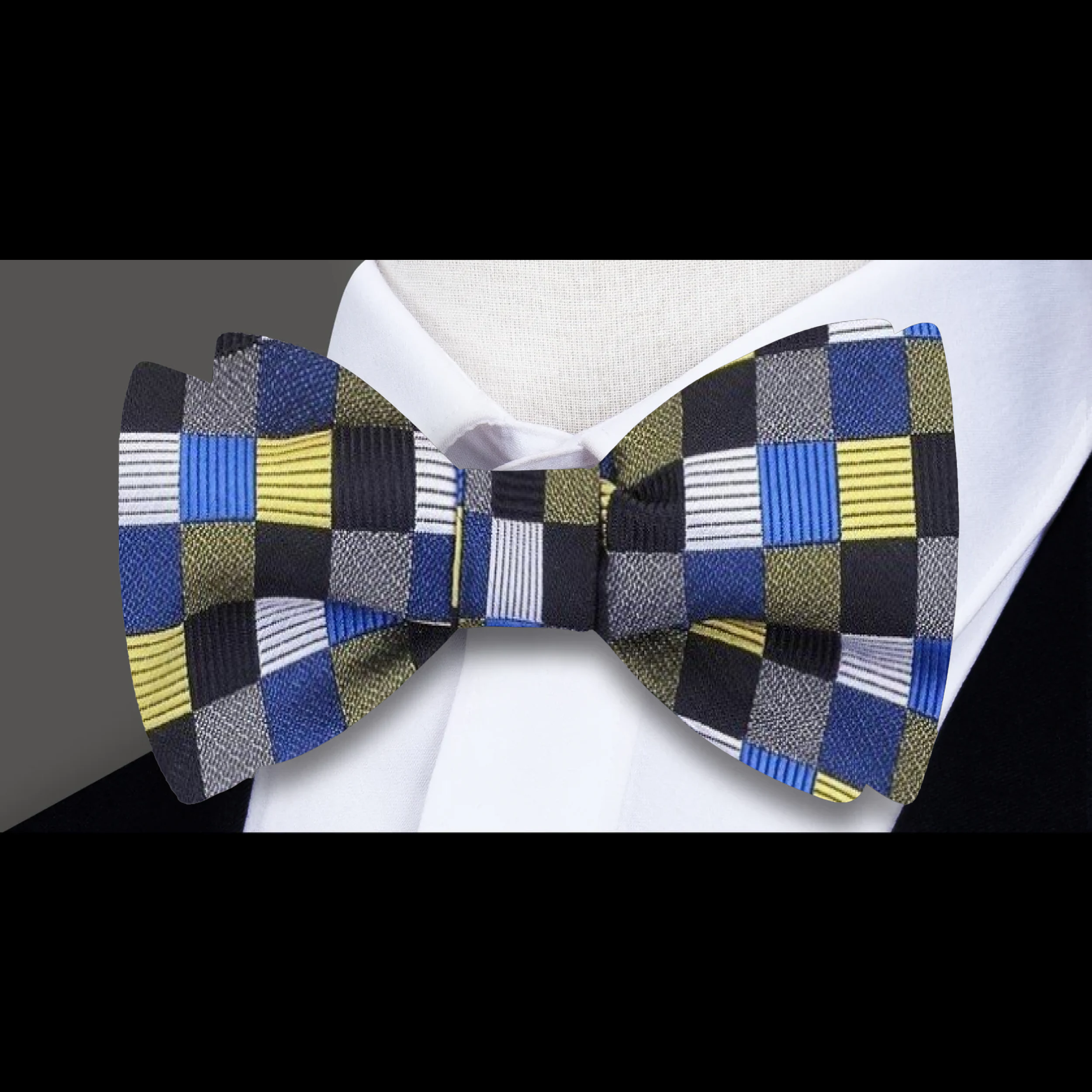 Silk self-tie bow tie with geometric pattern worn at a wedding