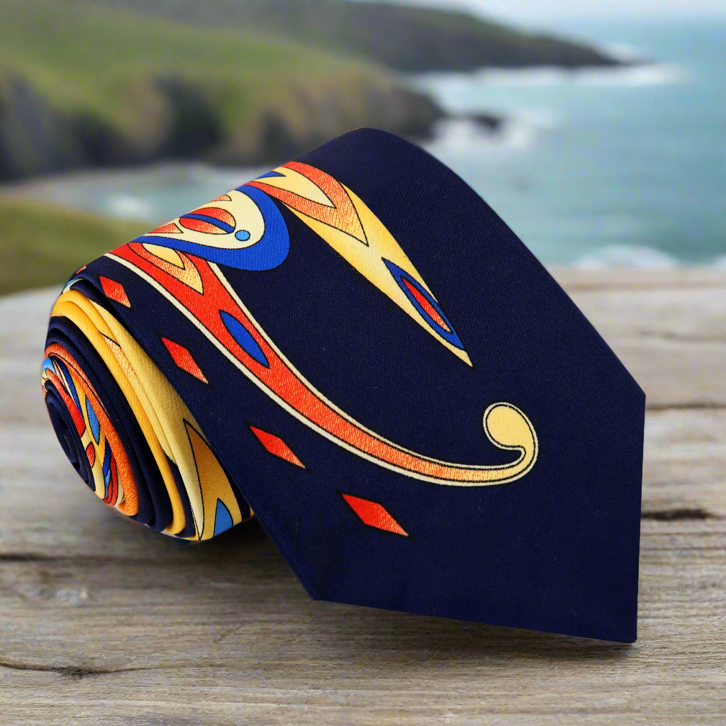 Elegant paisley silk necktie in blue, yellow, and orange hues, ideal for formal events and weddings