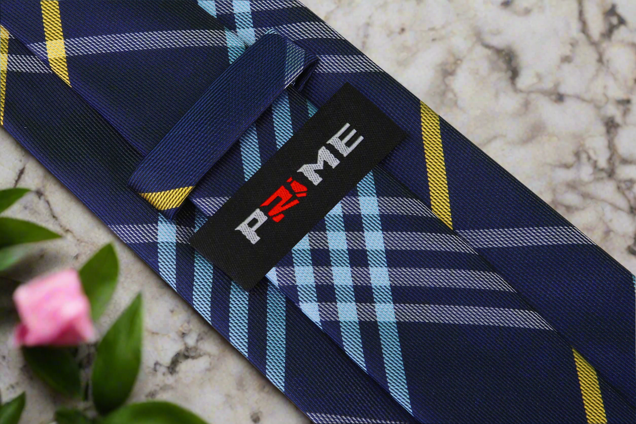 Man wearing the stylish plaid silk tie with a navy suit for a wedding
