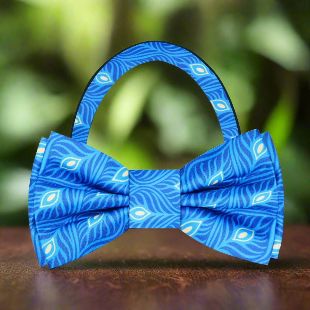 Silk bow tie with peacock feather design, ideal for groomsmen and special occasions