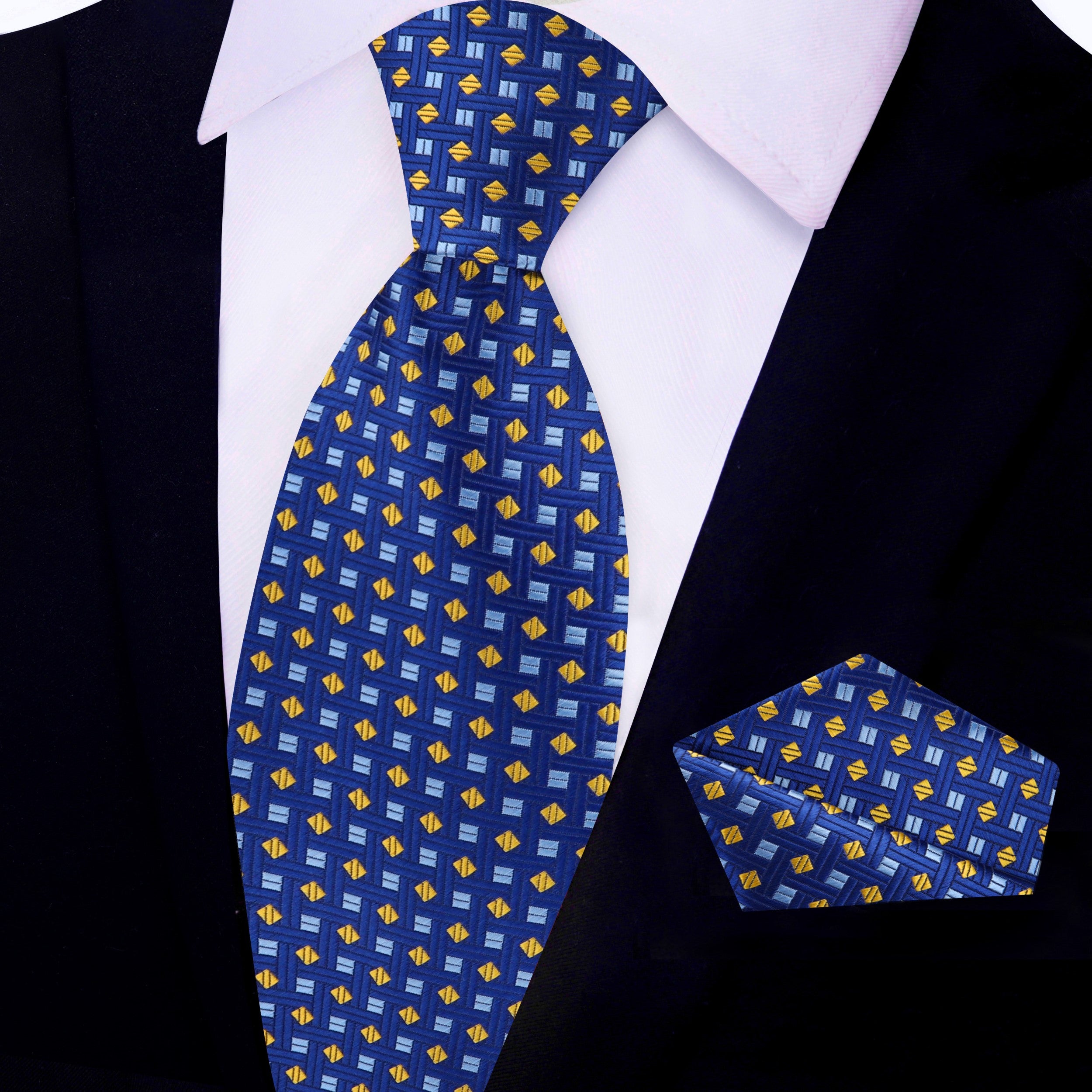 Elegant blue geometric necktie displayed on a white dress shirt, highlighting its vibrant patterns.