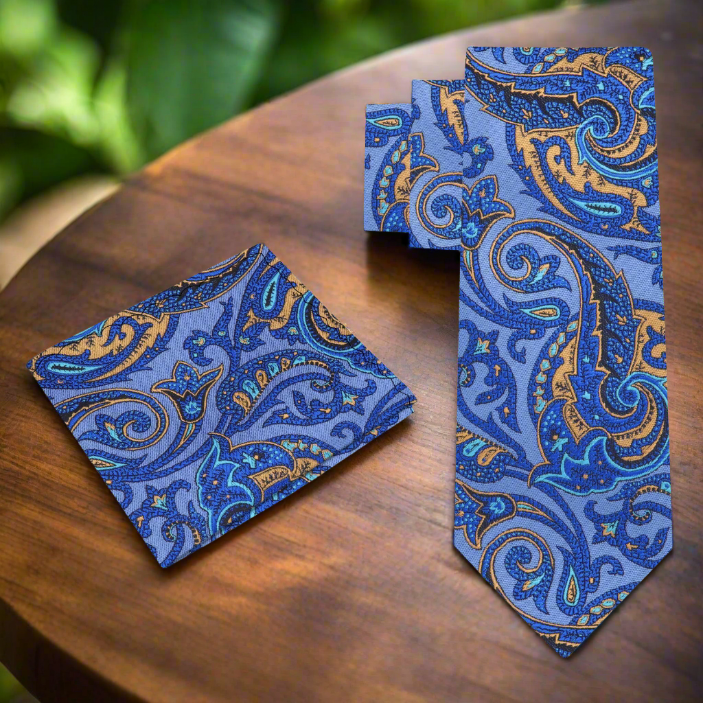 Styled mens paisley tie with white dress shirt and navy suit