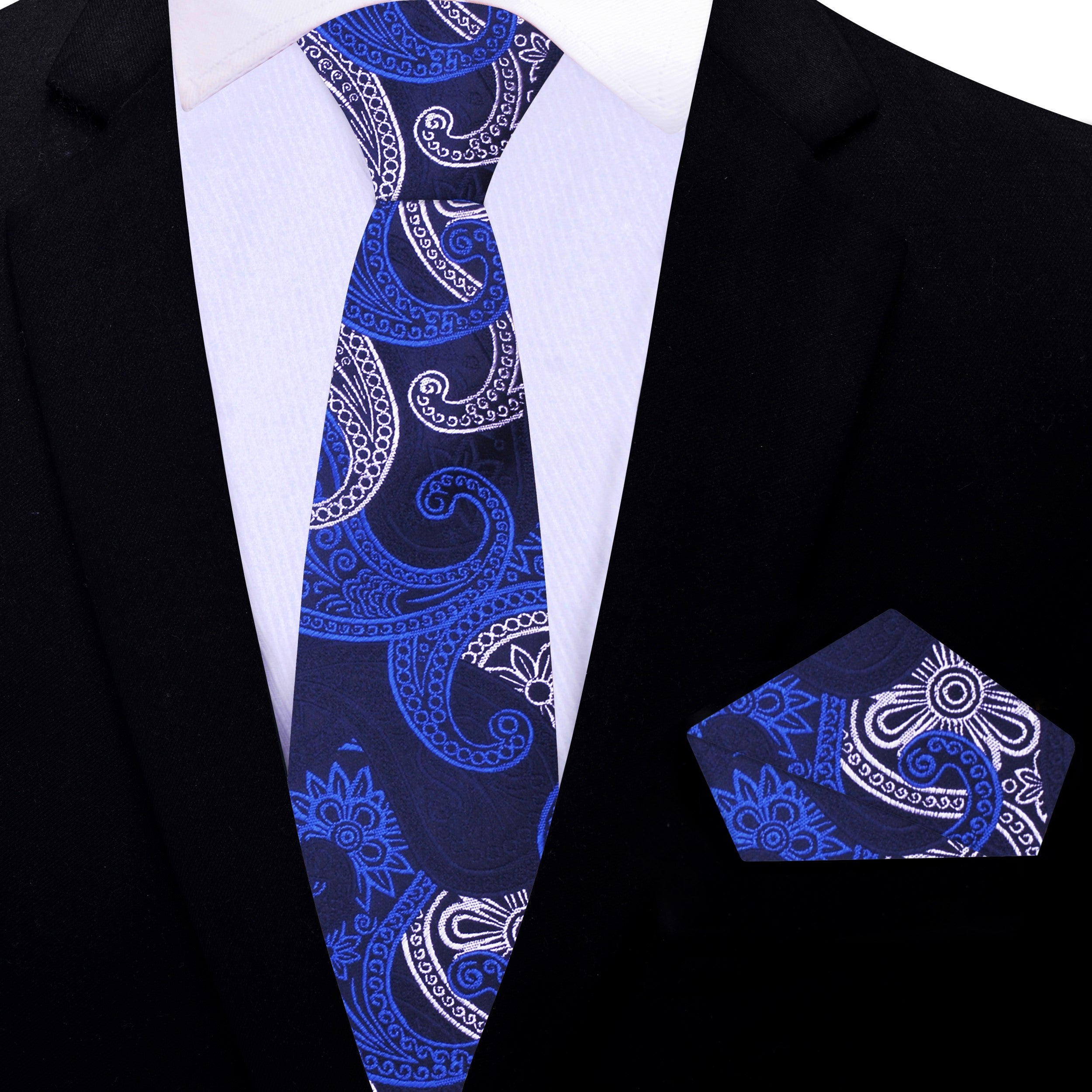 Man wearing the blue paisley tie at a wedding, perfectly paired with a navy suit.