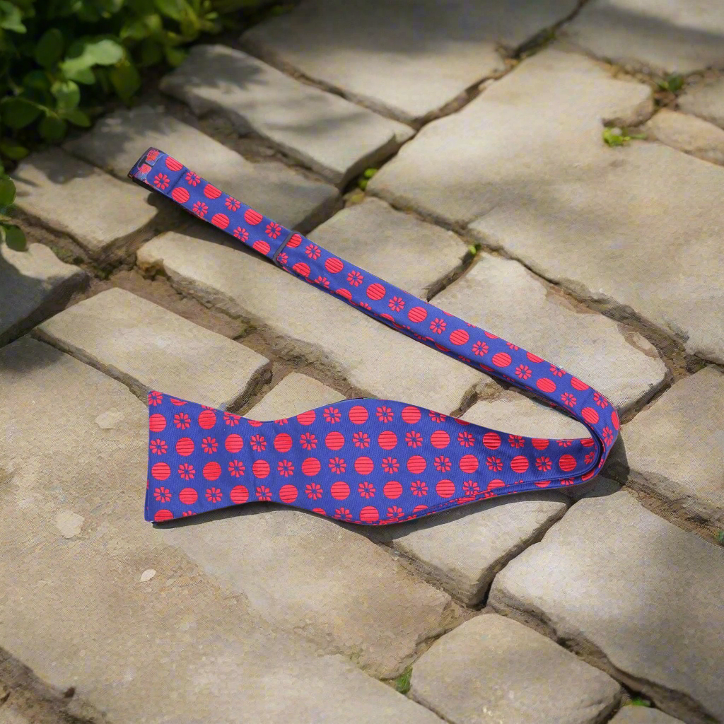 Close-up of the vibrant floral pattern on the silk bow tie