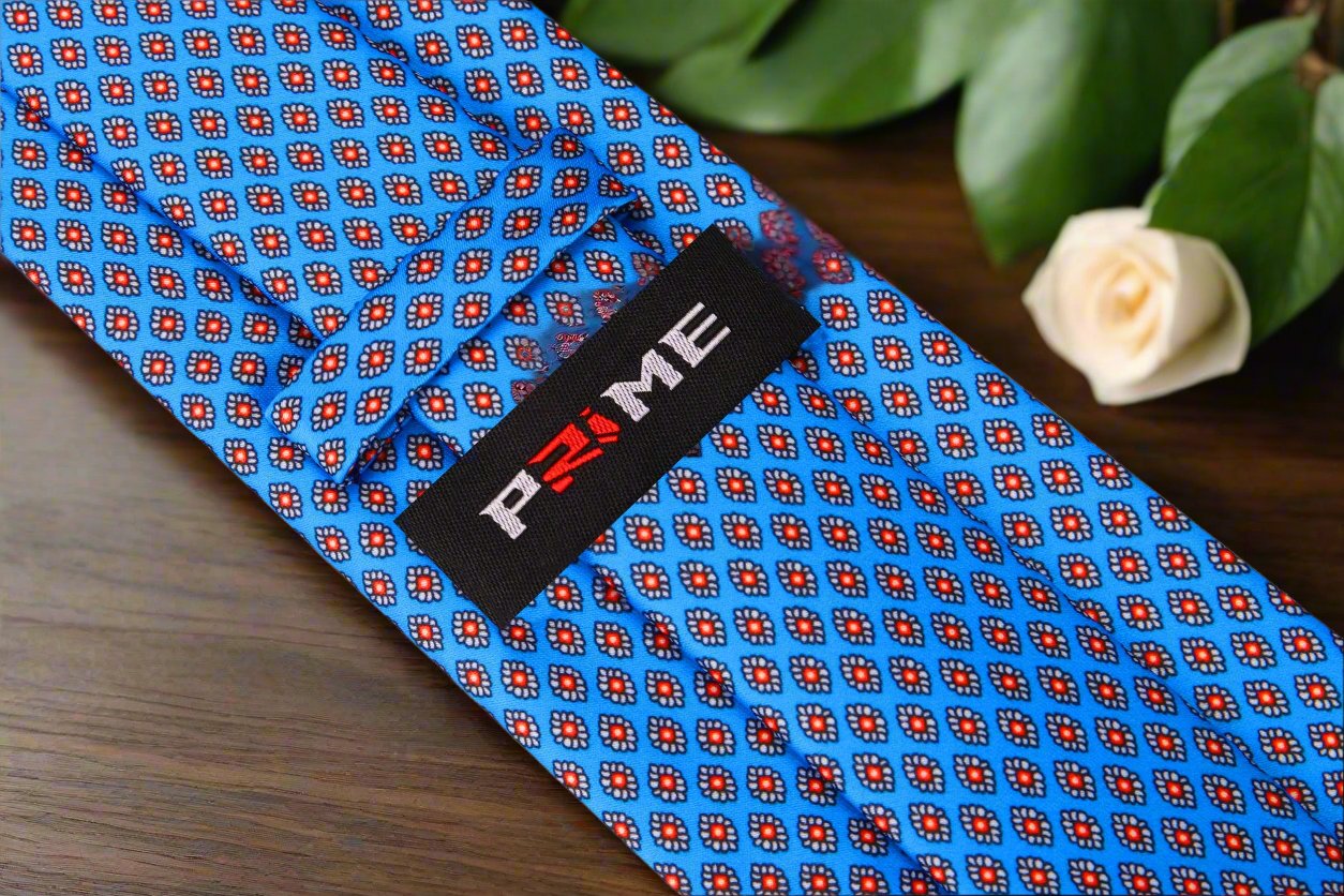 Close-up of the fabric texture highlighting the geometric medallion pattern on the mens silk tie