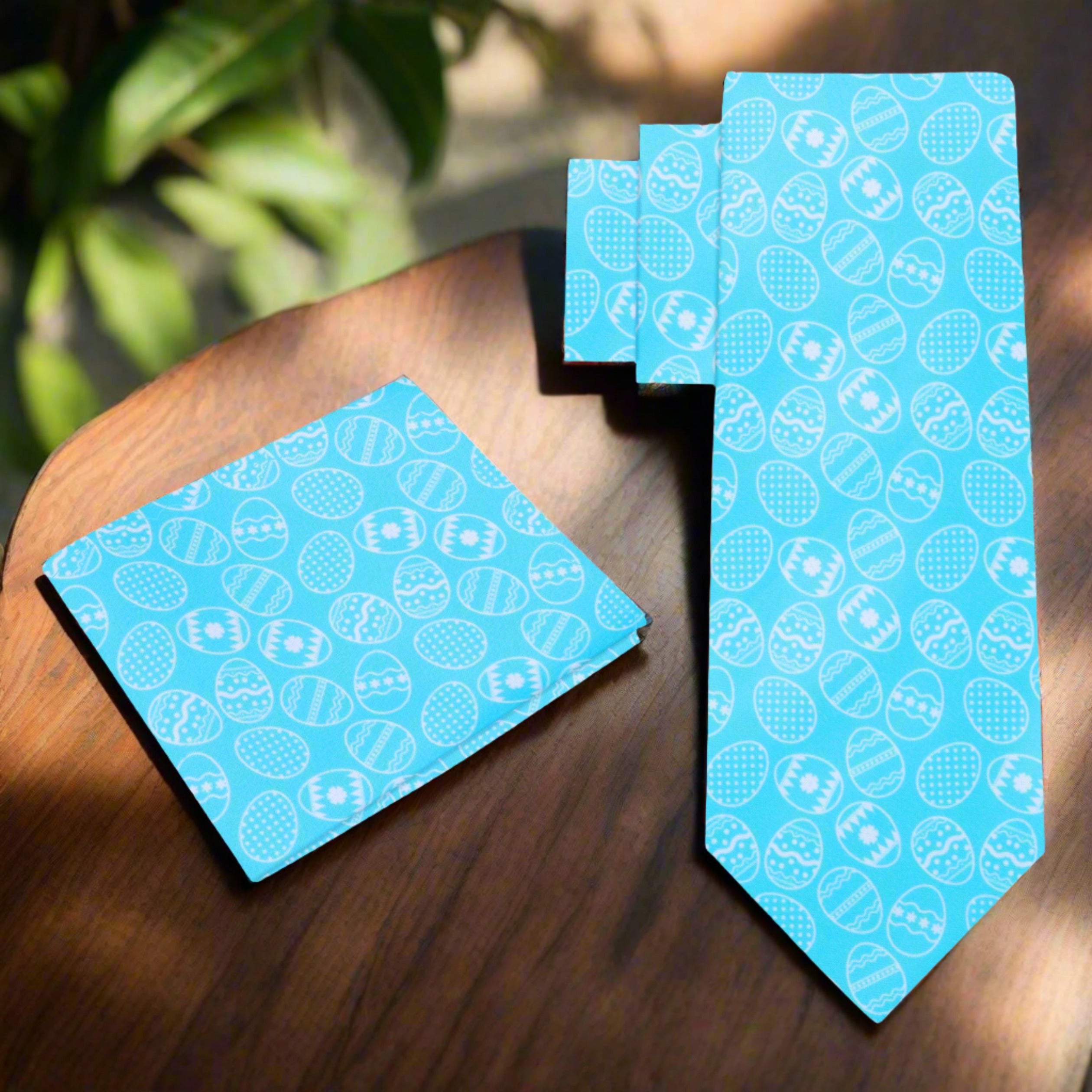 Styled shot of the Easter necktie paired with a crisp white shirt and light grey suit.