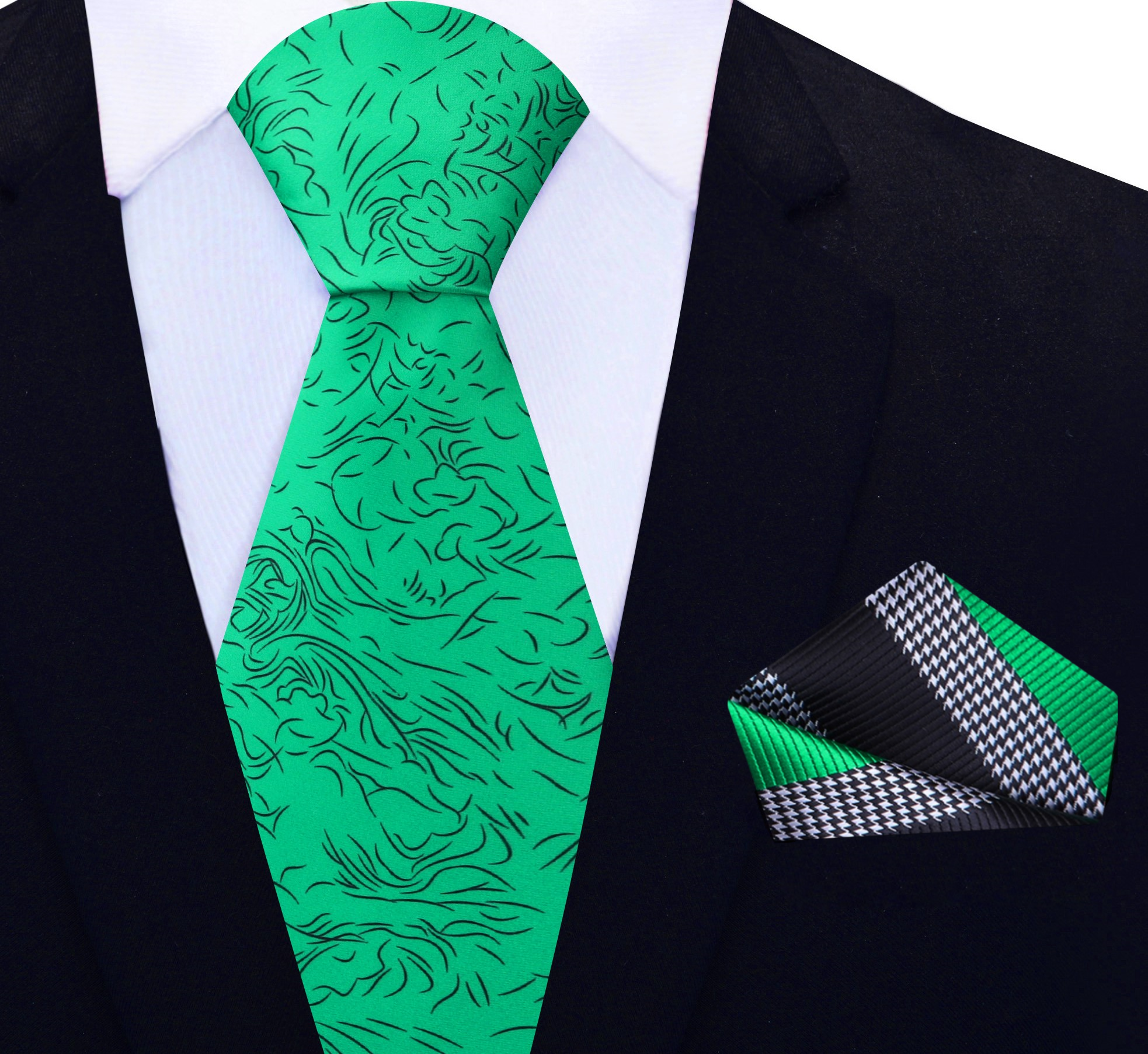 Close-up of a designer green necktie featuring modern black abstract lines