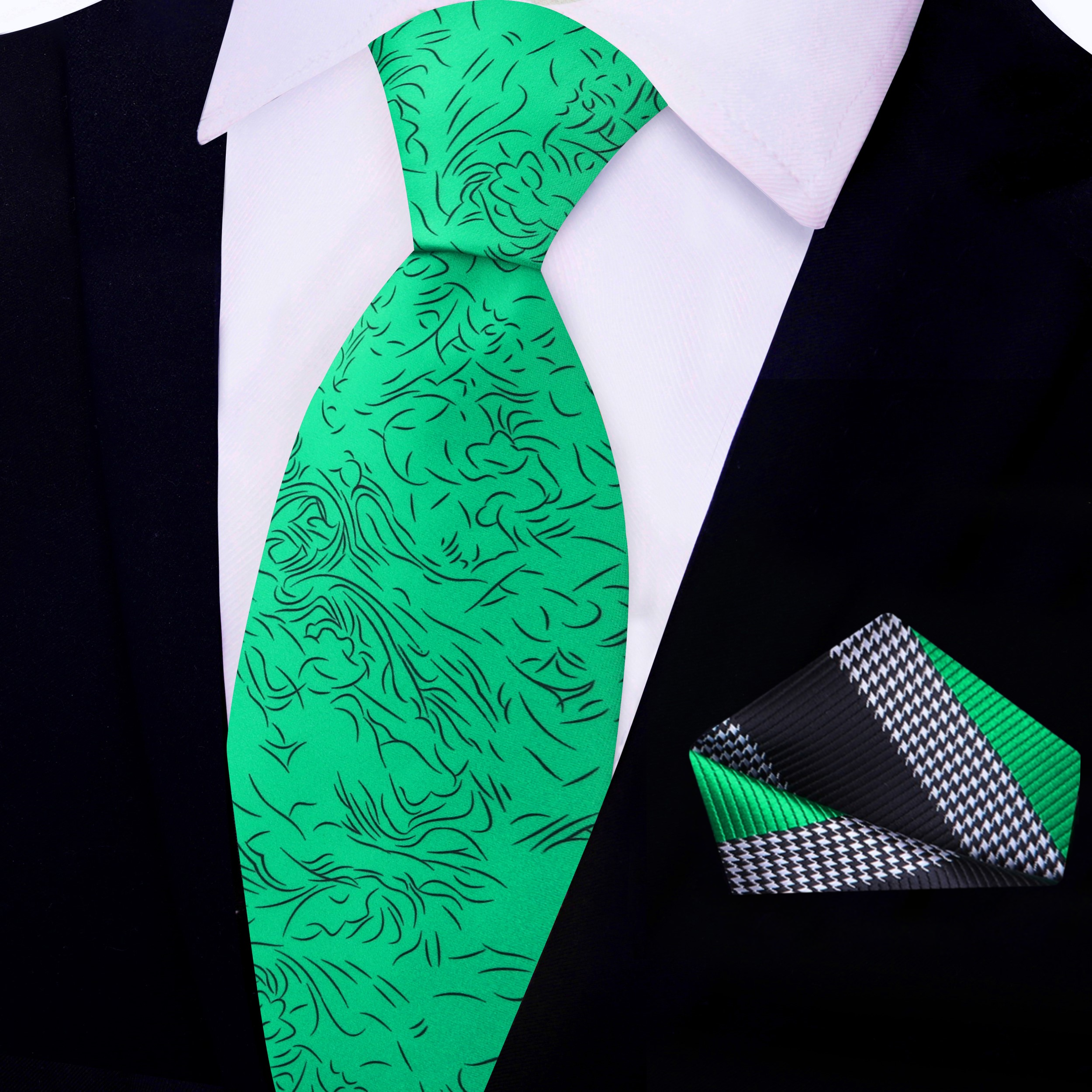 Man wearing a green silk necktie with abstract lines at a wedding