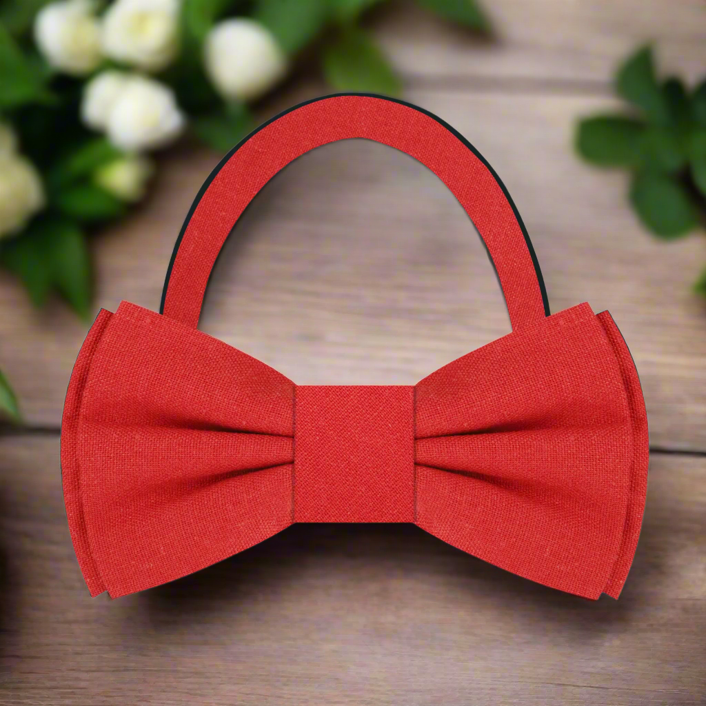 Fashionable man adjusting a deep red linen bow tie, showcasing effortless elegance