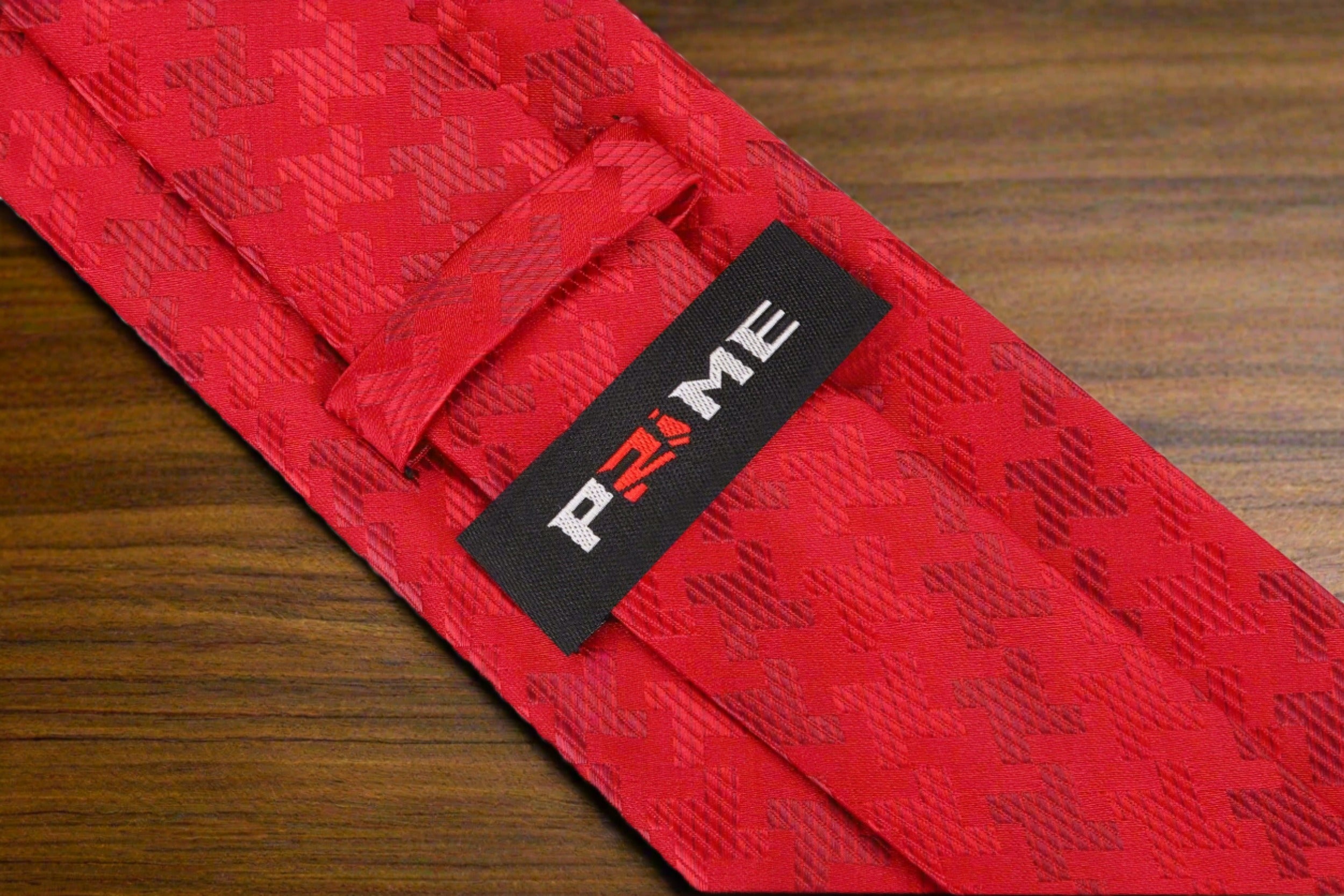 Elegance Red Houndstooth Silk Necktie styled with a navy suit and white shirt.