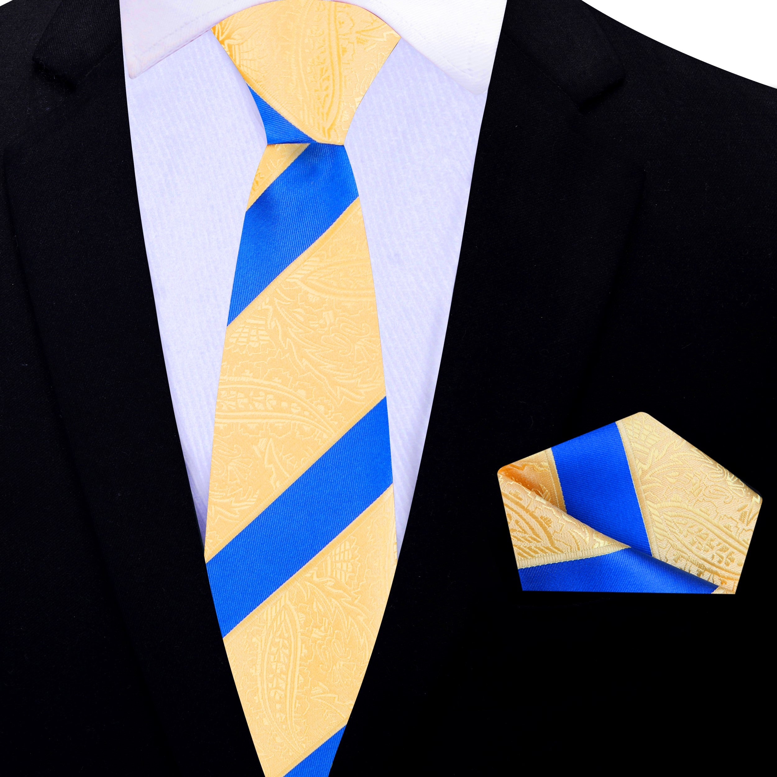 Vibrant yellow paisley necktie on a suit jacket, showcasing the elegant design.
