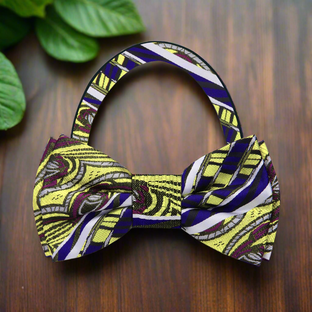Stylish man wearing an adjustable bright yellow bow tie at a garden party.