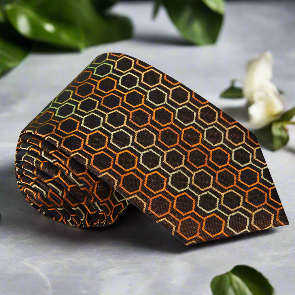 Elegant brown silk necktie with 3D geometric honeycomb pattern, styled with a crisp white dress shirt.