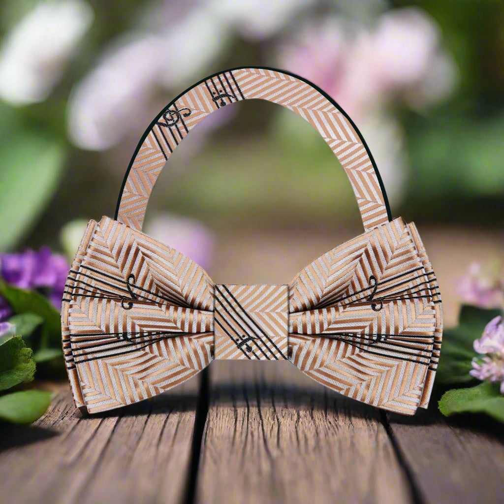 Close-up of a silk music-themed bow tie with sheet music pattern, ideal for concerts