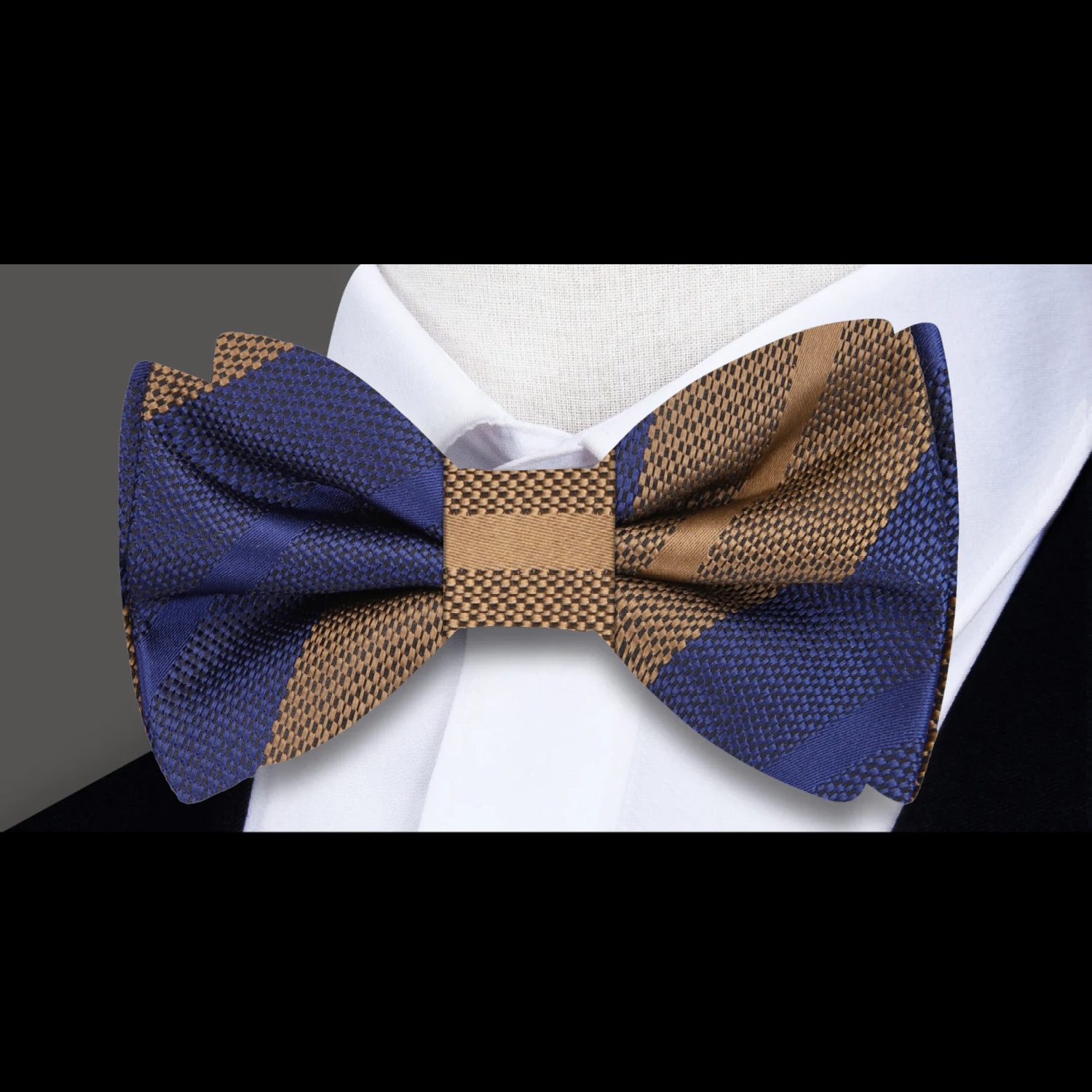 Fashionable mens striped silk bow tie paired with navy suit for formal events