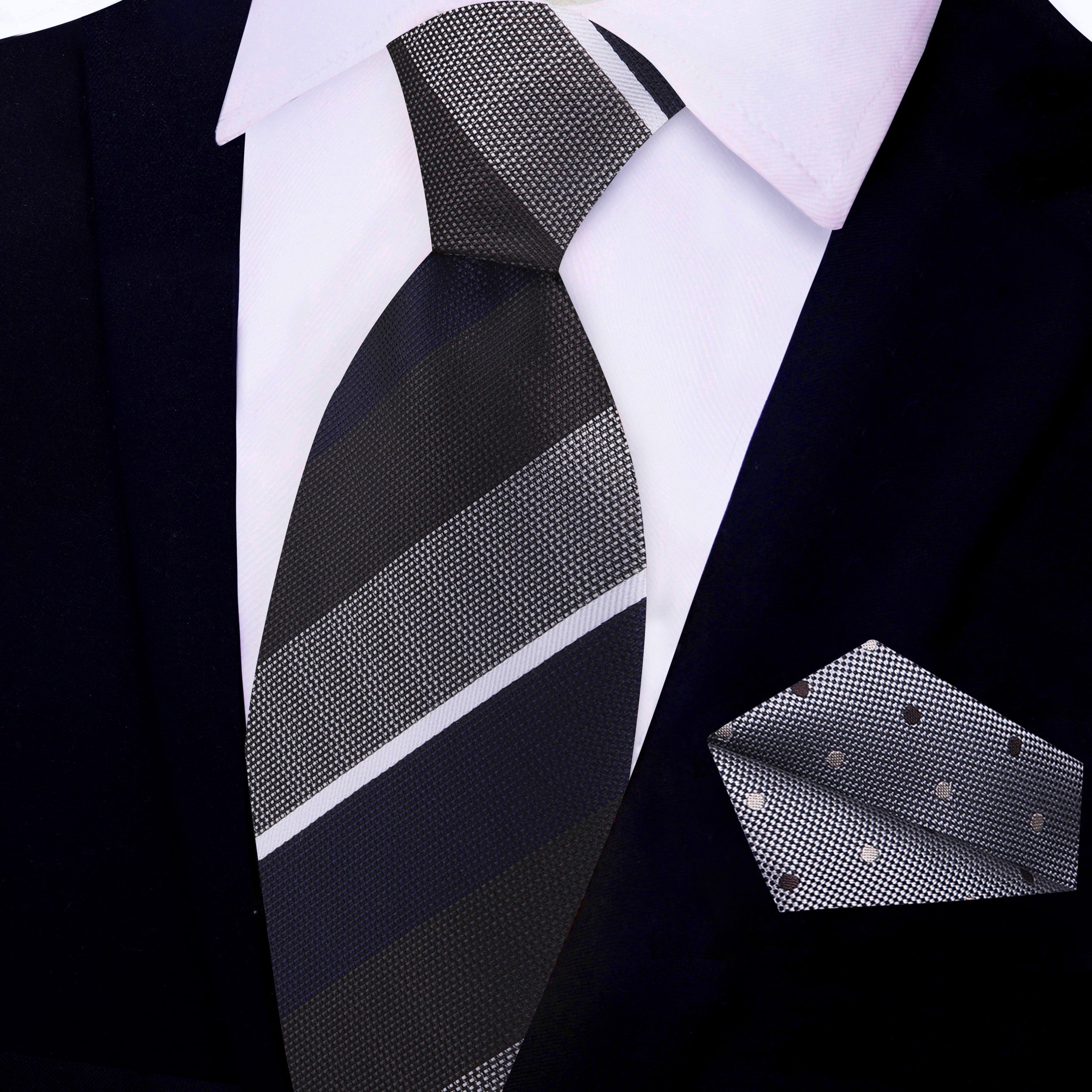 Tie and pocket square set laid flat—highlighting silk texture and refined stripe design.