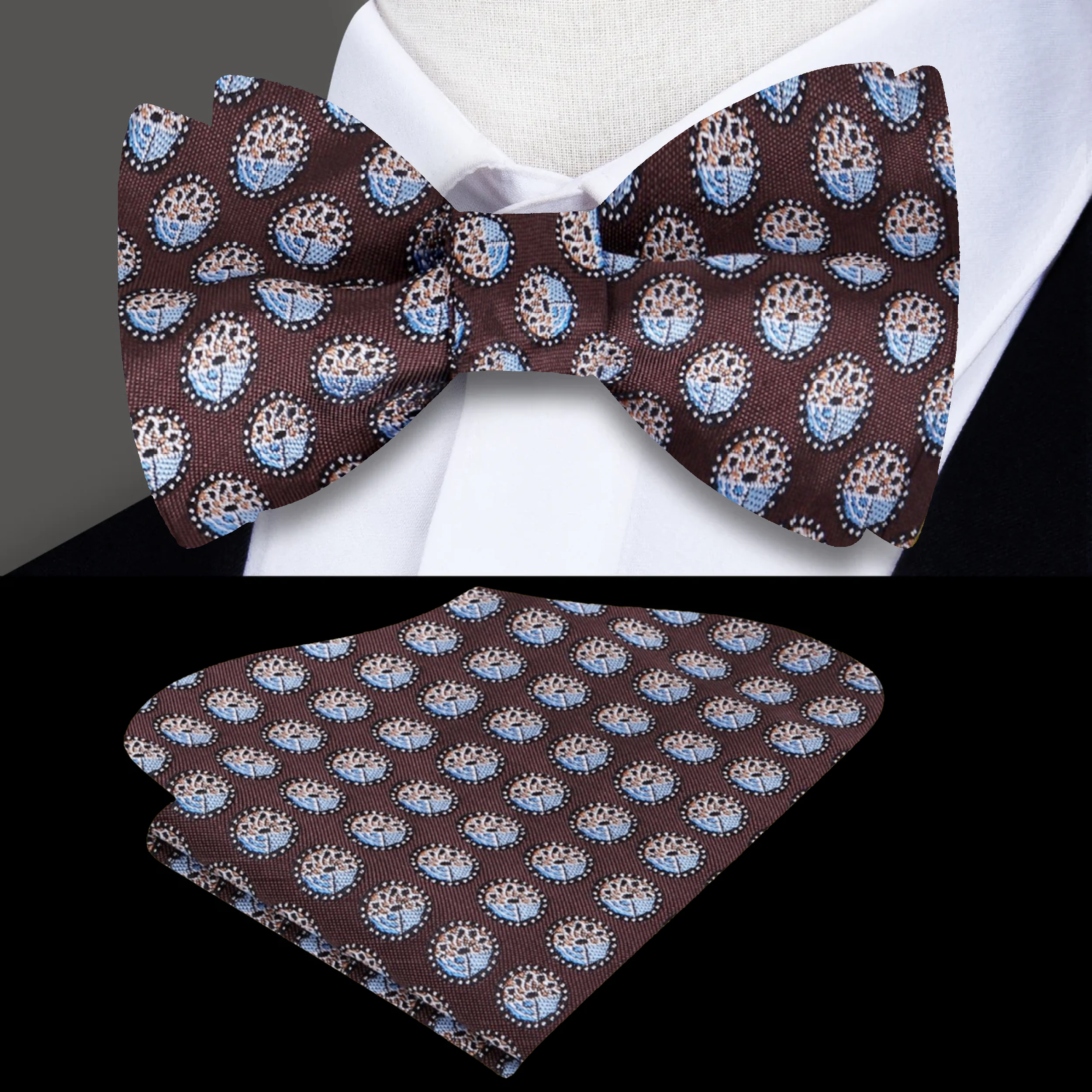 Model wearing plum pattern bow tie, paired with a navy suit.