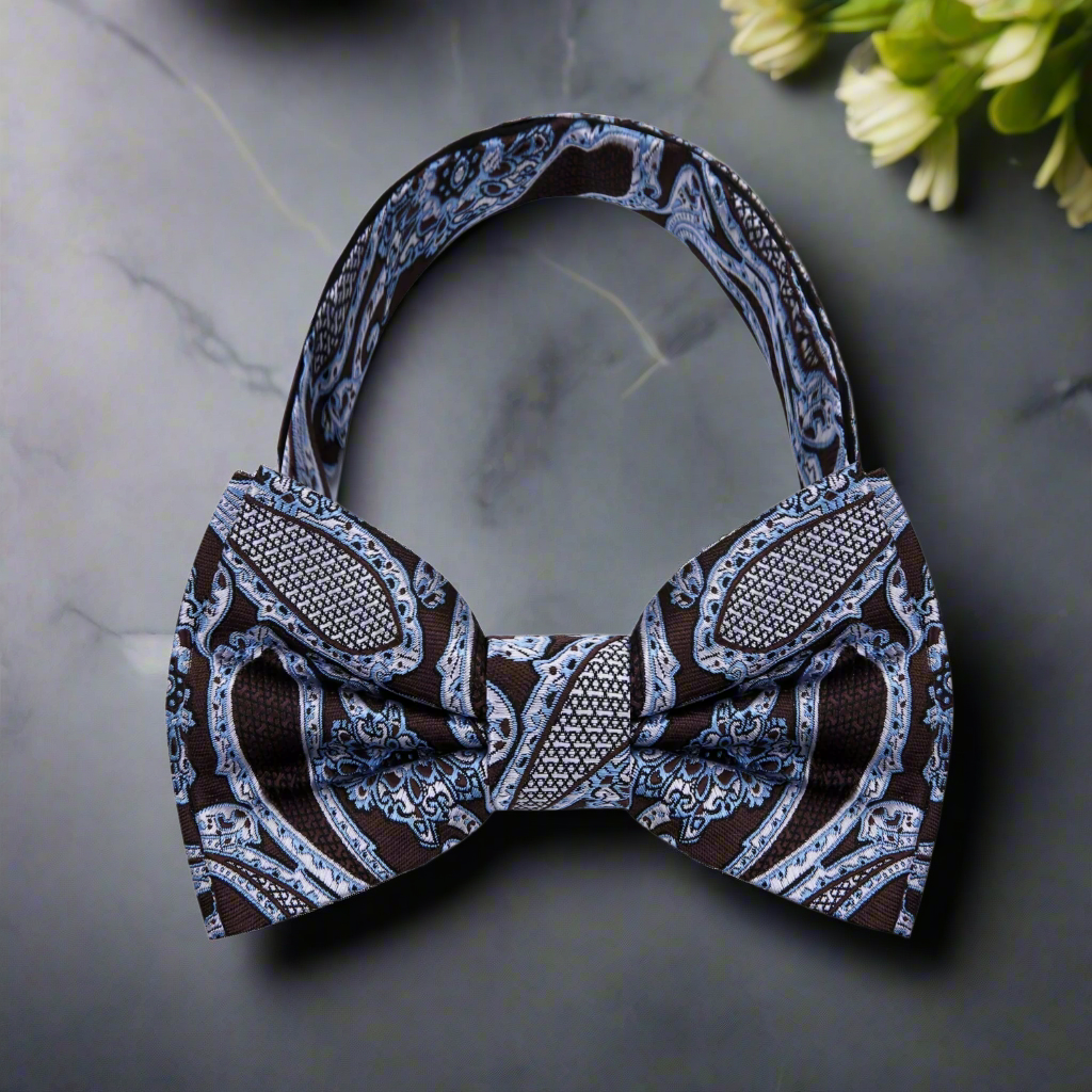 Man wearing a pre-tied paisley bow tie at a formal event