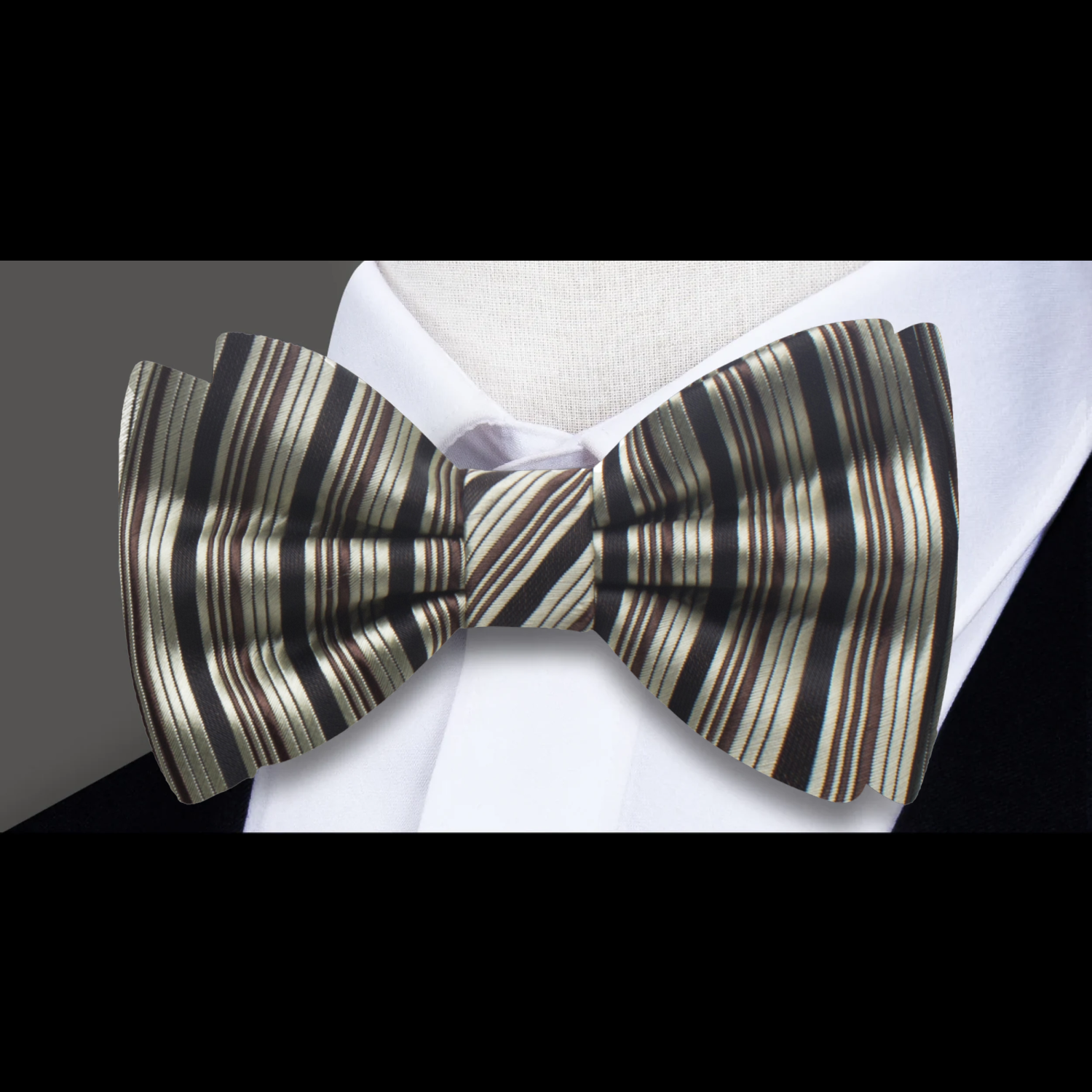 Matching pocket square alongside a silk bow tie, highlighting coordinated outfit options.
