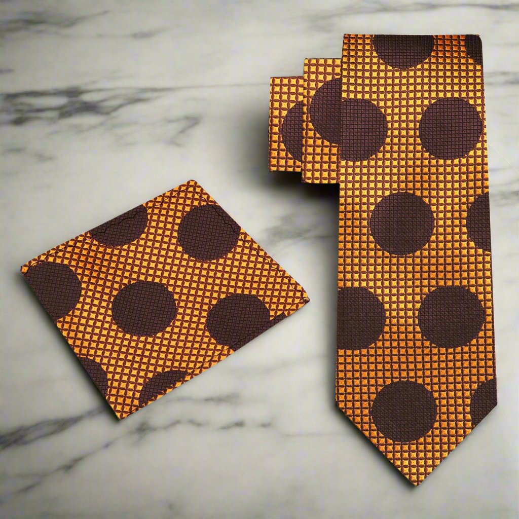 Close-up of golden orange polka dot silk tie on a dress shirt