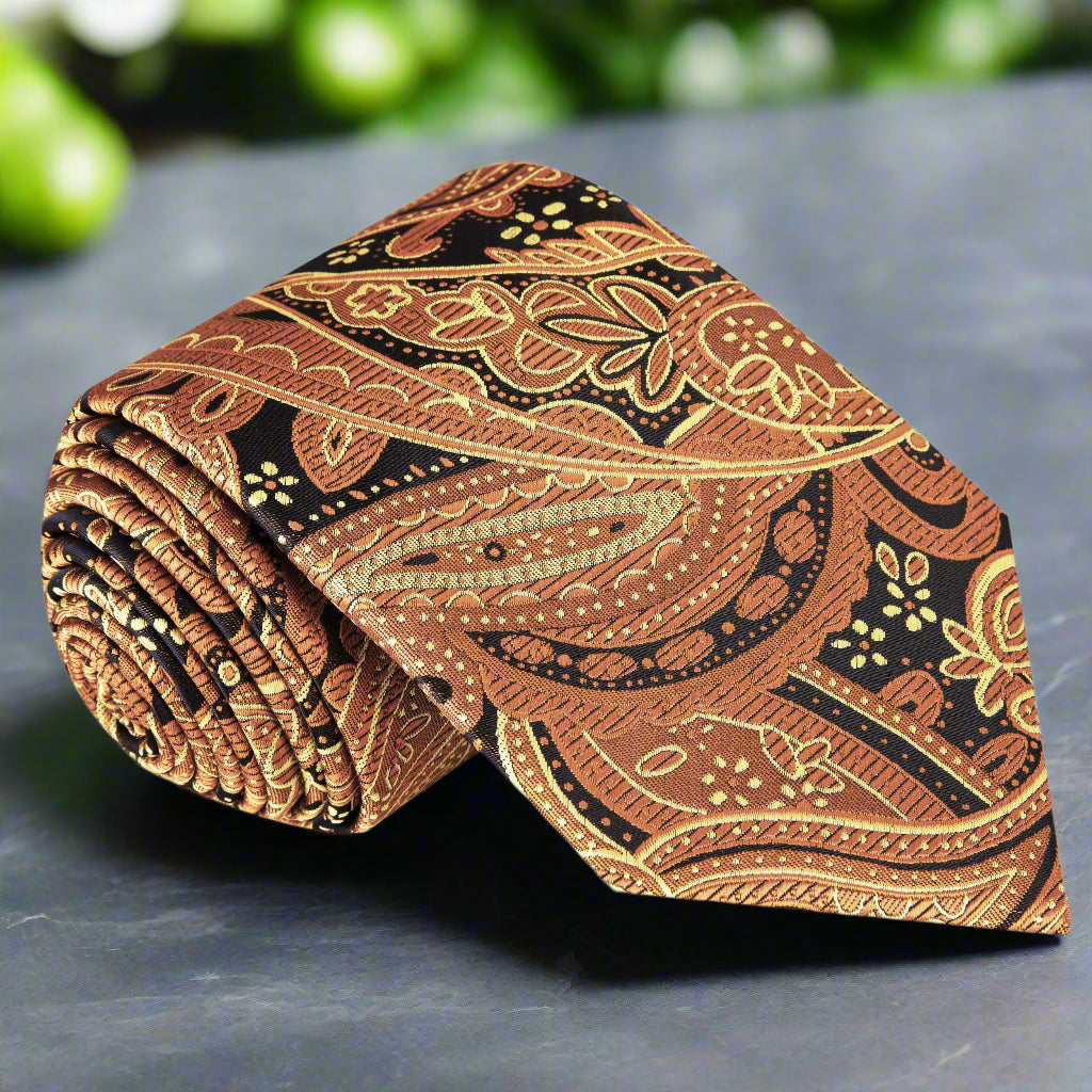 Close-up of the elegant brown paisley silk tie showcasing intricate patterns.