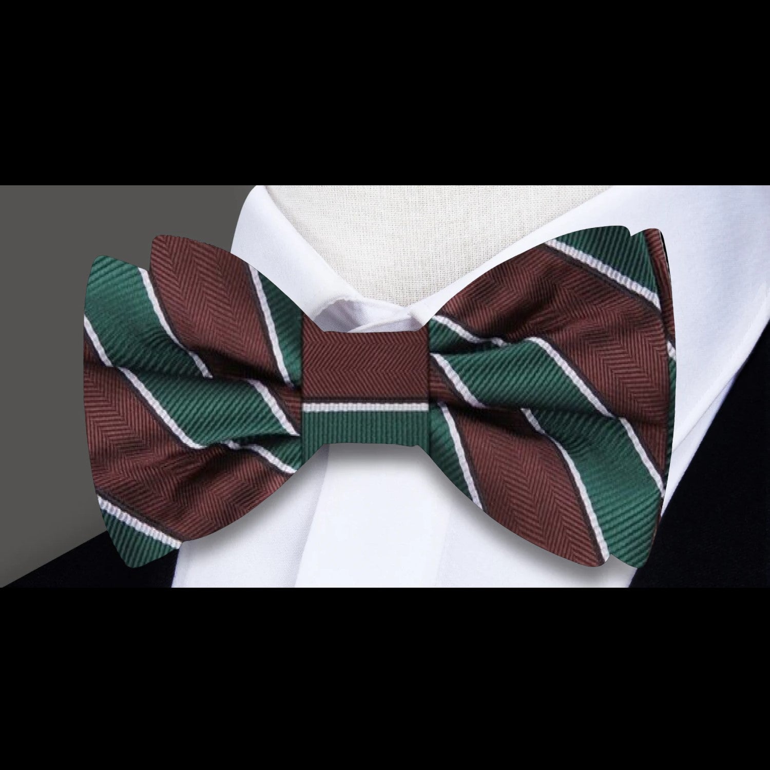 Close-up of the olive and light brown striped bow tie, showcasing the rich silk texture.