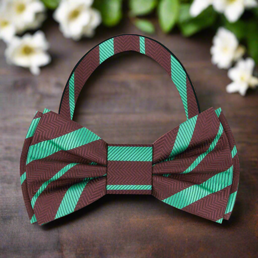 Close-up of green and brown silk bow tie showcasing its luxurious fabric and stripe pattern