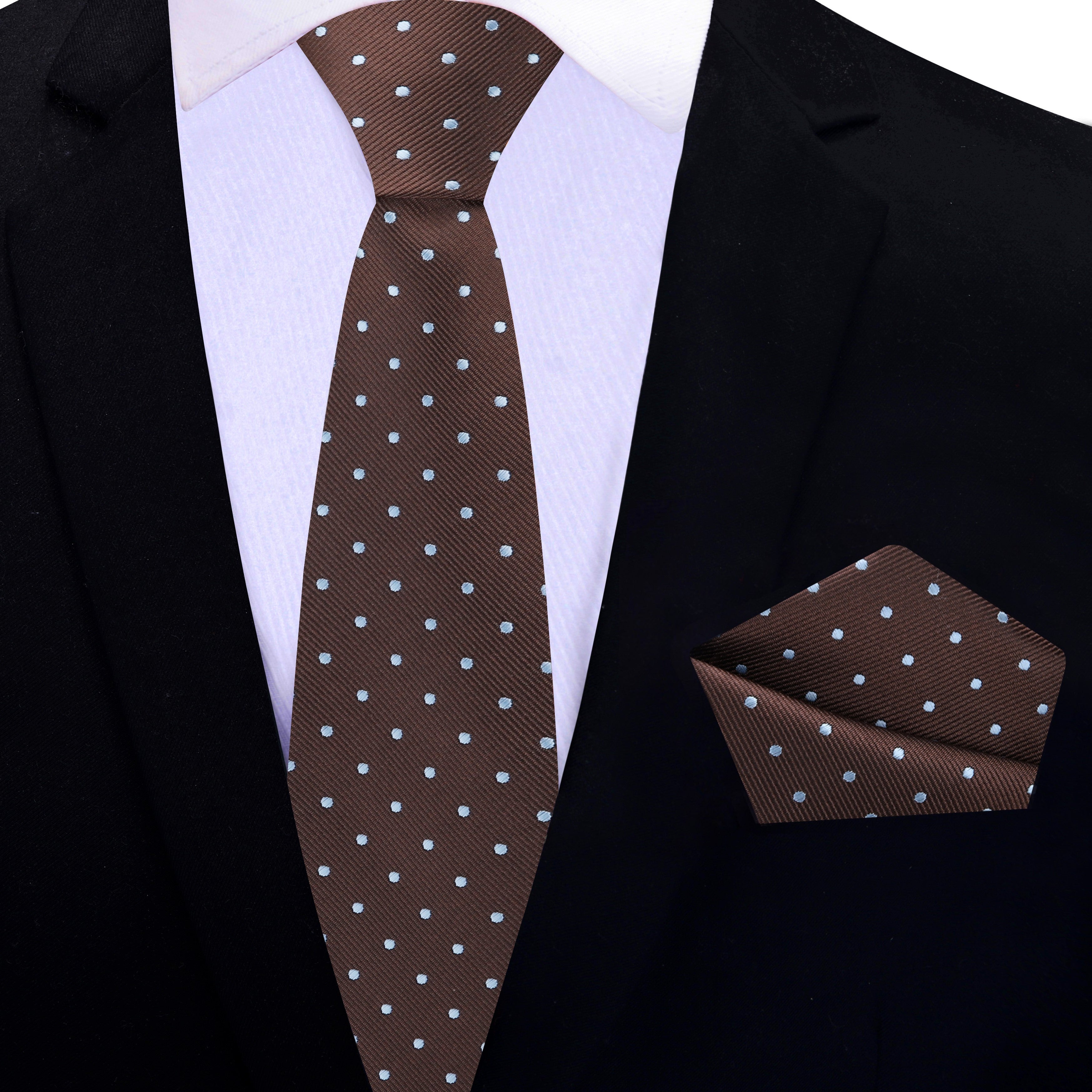 Fashionable polka dot silk tie styled with white dress shirt for formal occasion
