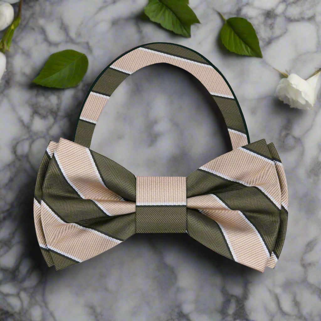 Hathersby silk striped bow tie in blue and green, displayed elegantly on a wooden table.