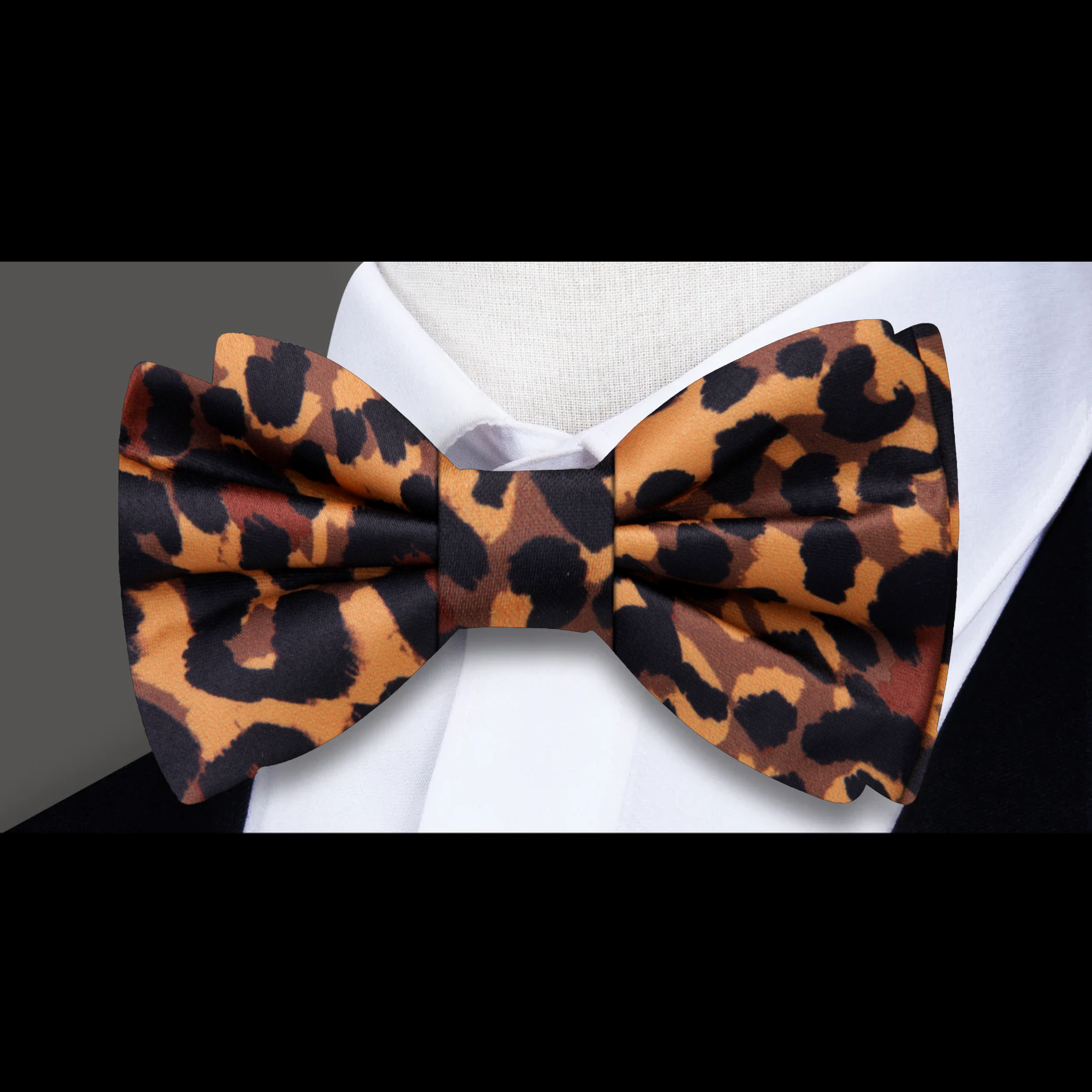 Close-up of a stylish mens bow tie with adjustable strap and wild animal print