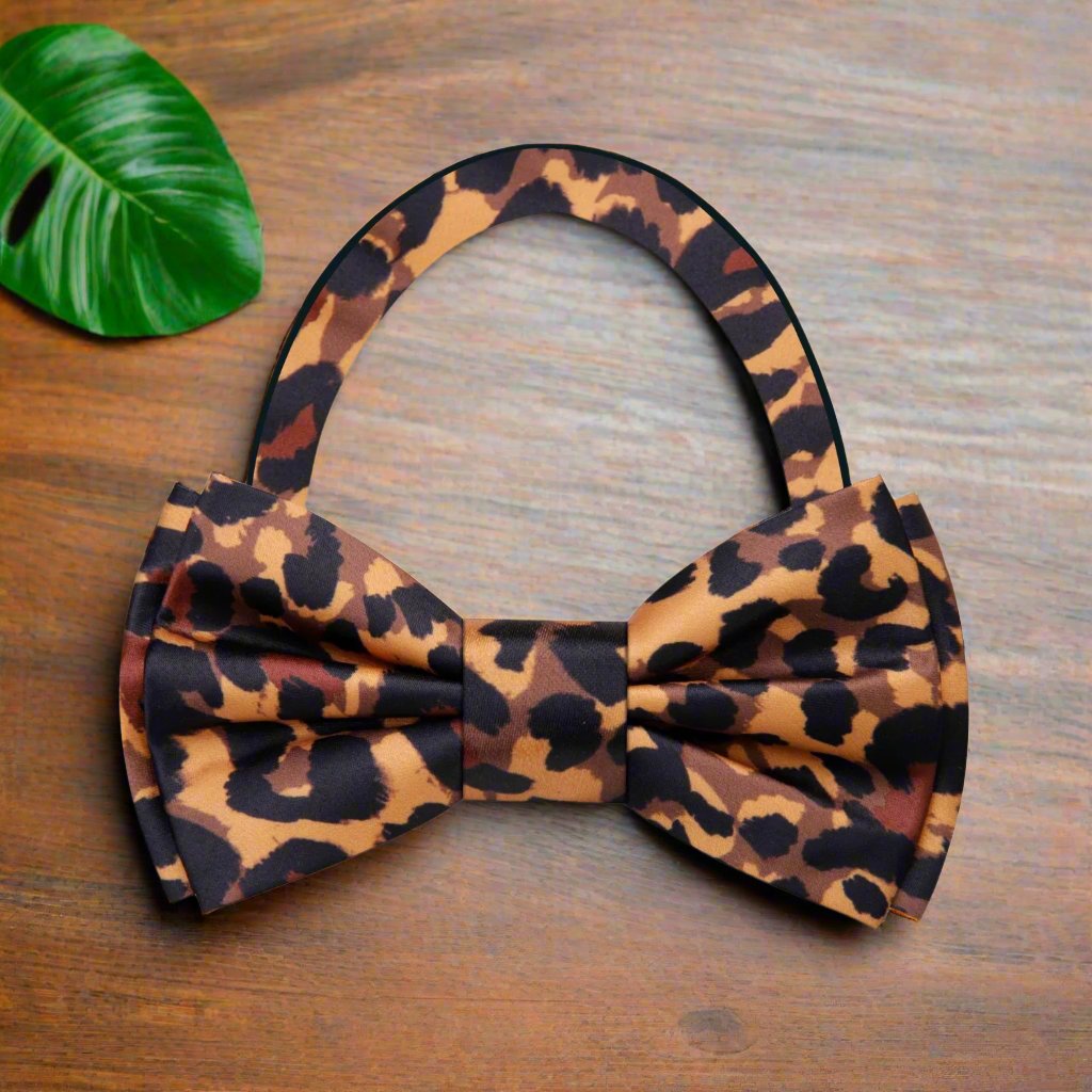 Mens bow tie featuring a bold cheetah print, perfect for weddings and parties