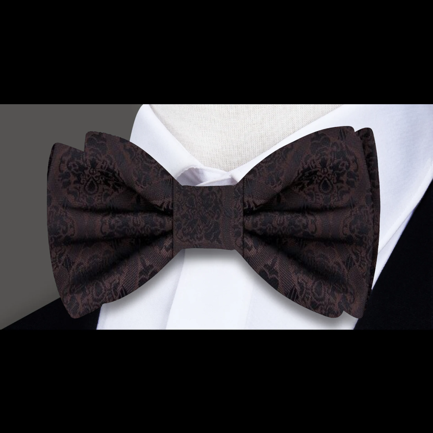 Model wearing the abstract silk bow tie at a wedding, styled with a crisp white dress shirt.