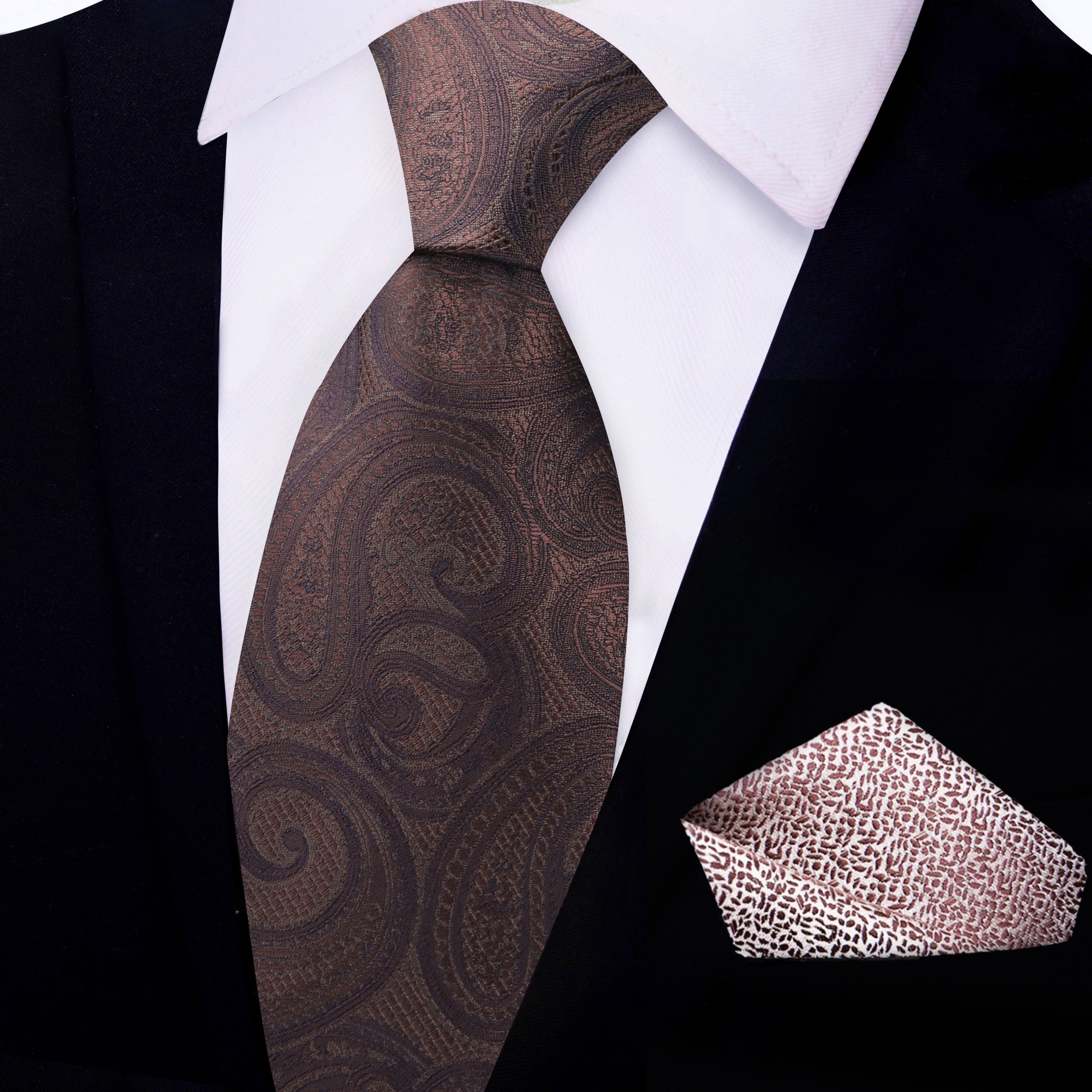 Elegant scene of the paisley tie paired with a navy suit and pocket square