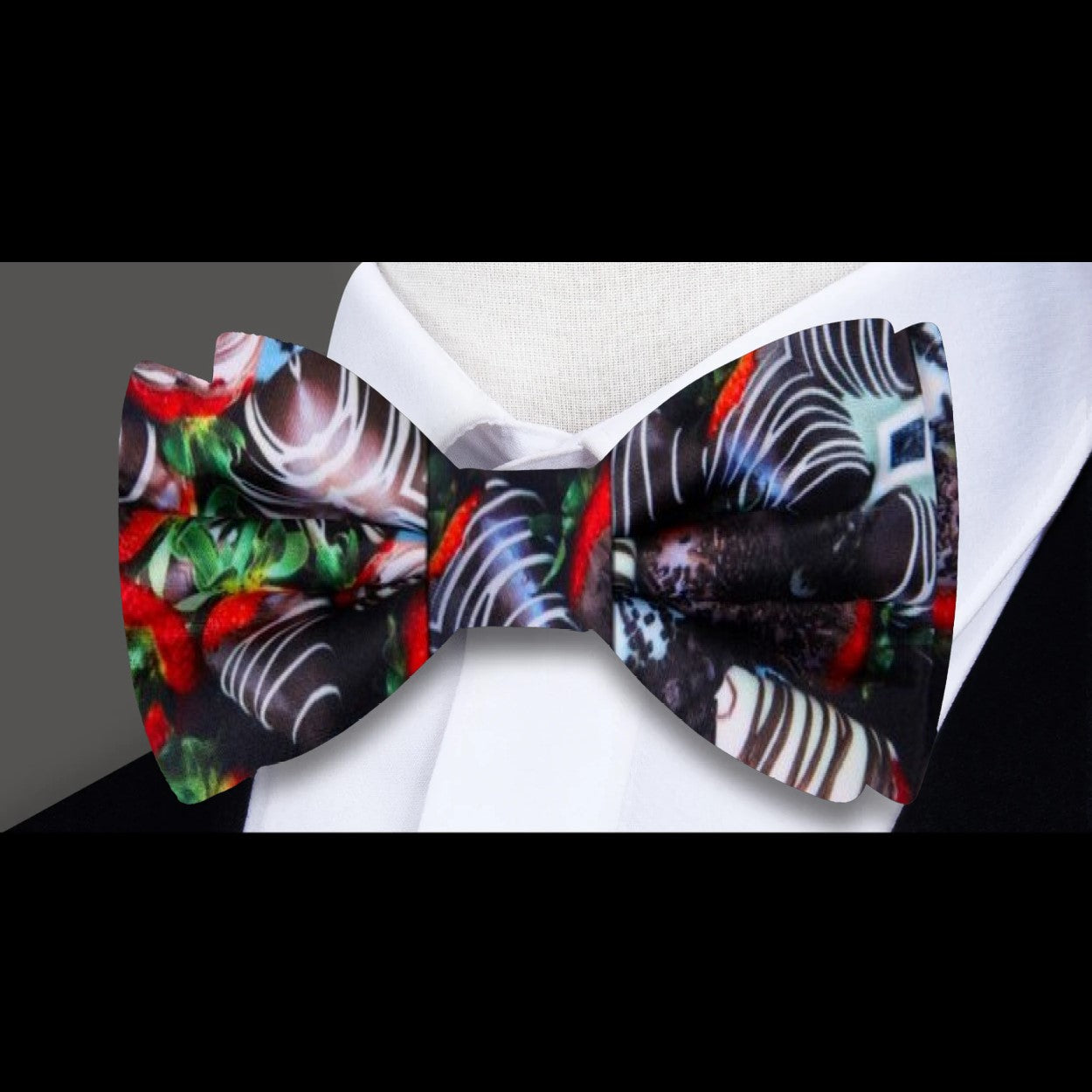 Close-up of the chocolate covered strawberries pattern bow tie, highlighting the playful design