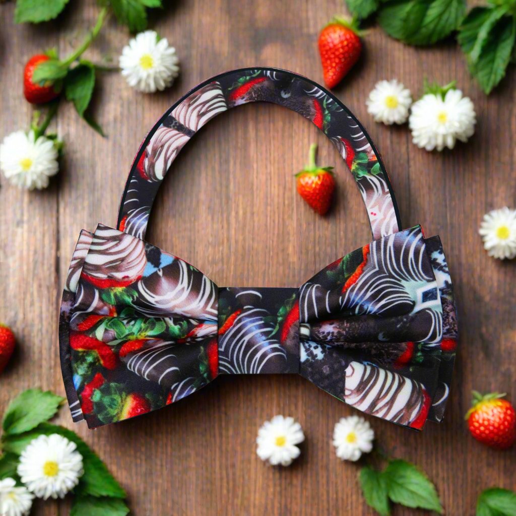 Fashionable accessories for romantic dinners featuring a playful bow tie with strawberry pattern