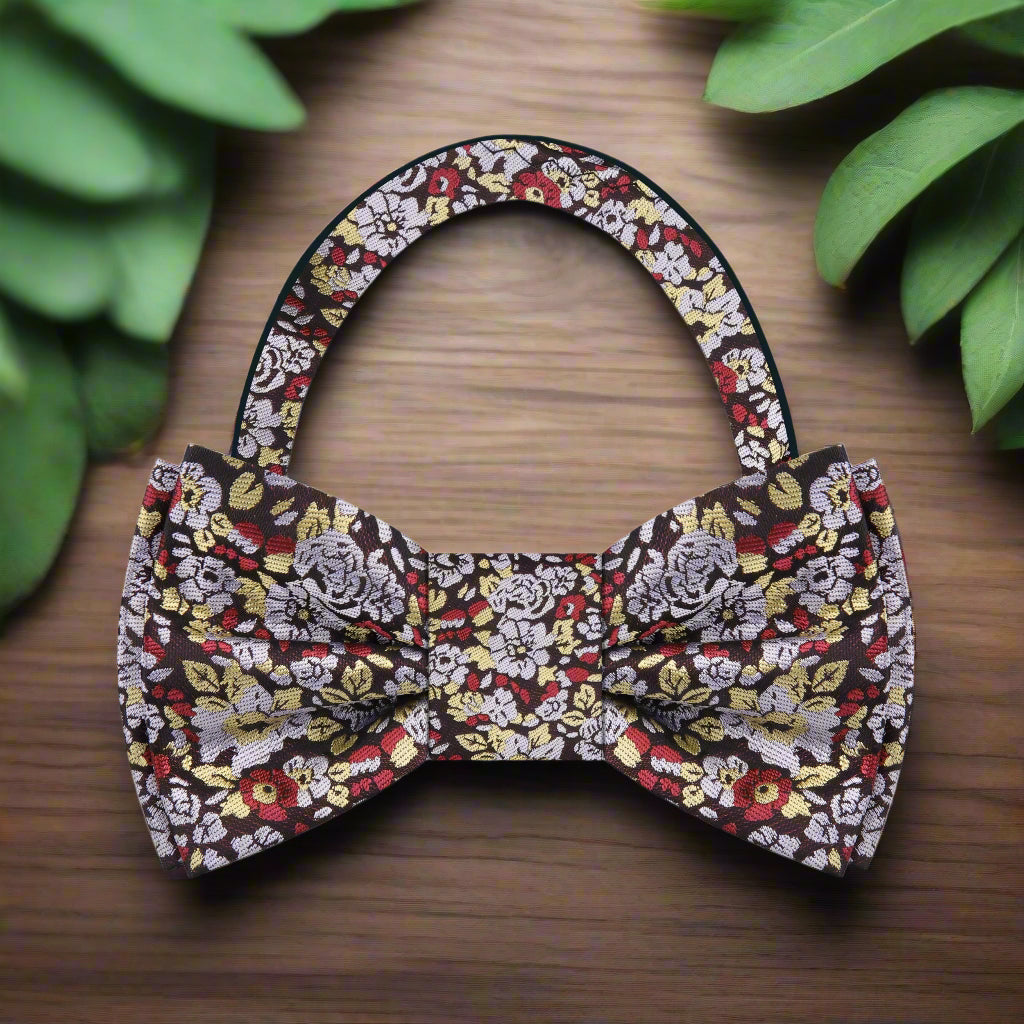 Groom wearing floral bow tie at wedding with formal attire