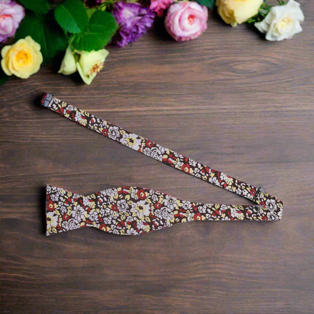 Close-up of Cranswick floral silk bow tie showing detailed pattern and rich colors