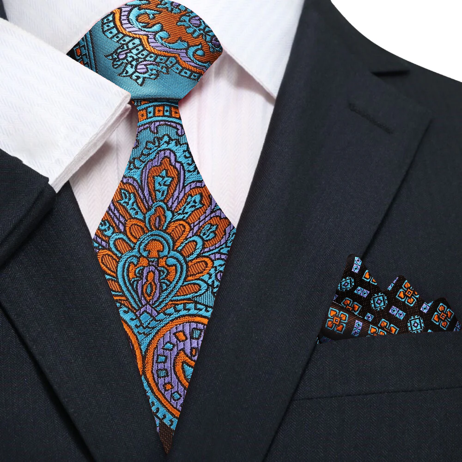 The teal and orange silk tie styled with a navy suit and white shirt.