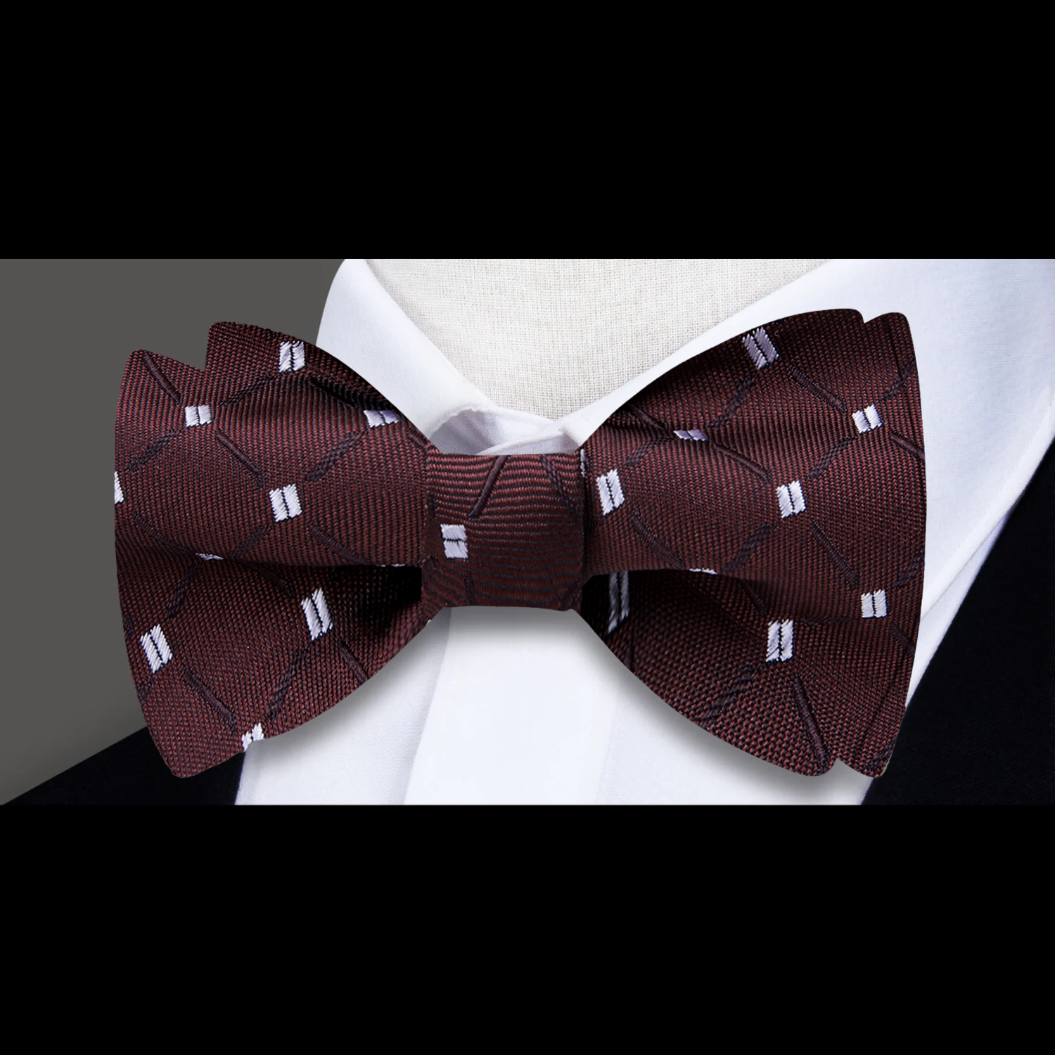 Elegant mens silk bow tie with geometric pattern for formal events