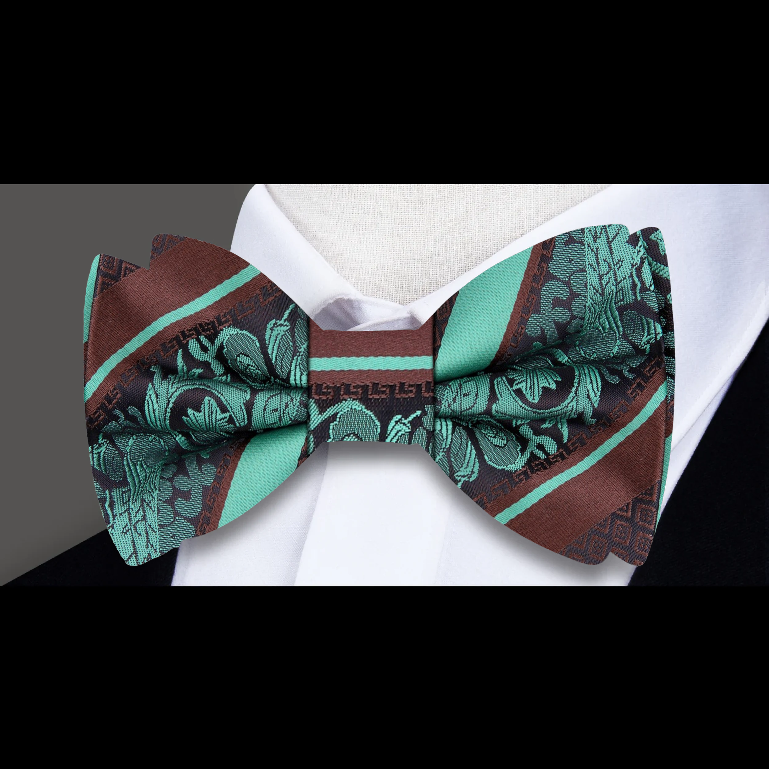 Close-up of the detailed paisley pattern on a luxury bow tie