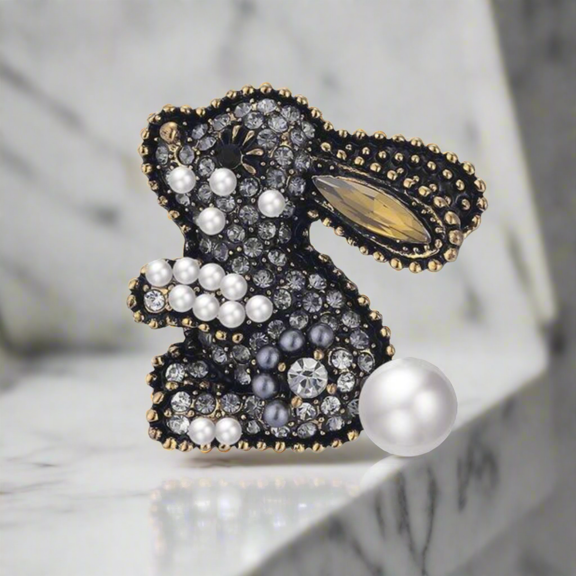 Close-up of a gemstone lion lapel pin with detailed craftsmanship