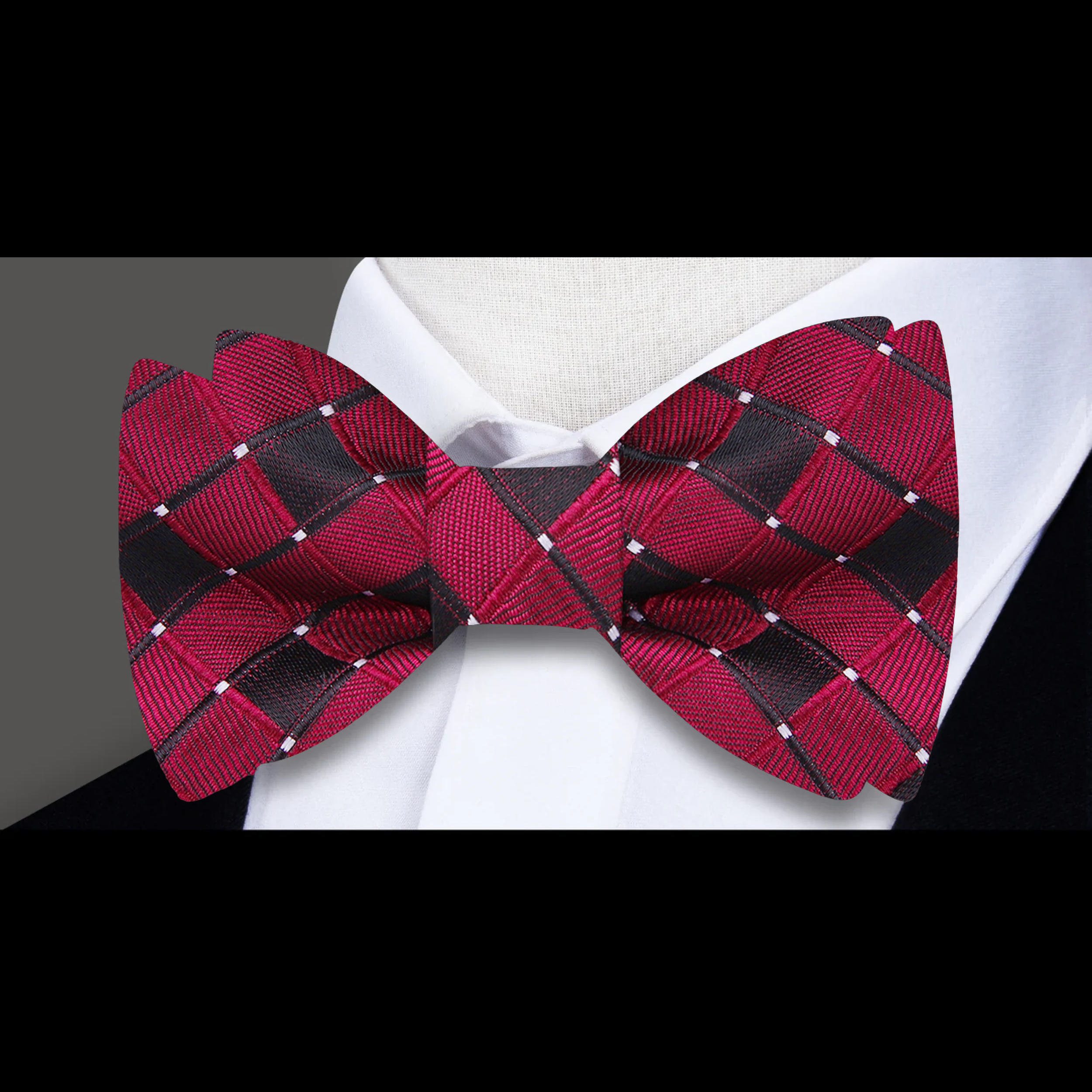 Formal ensemble with silk bow tie and pocket square worn at a business event