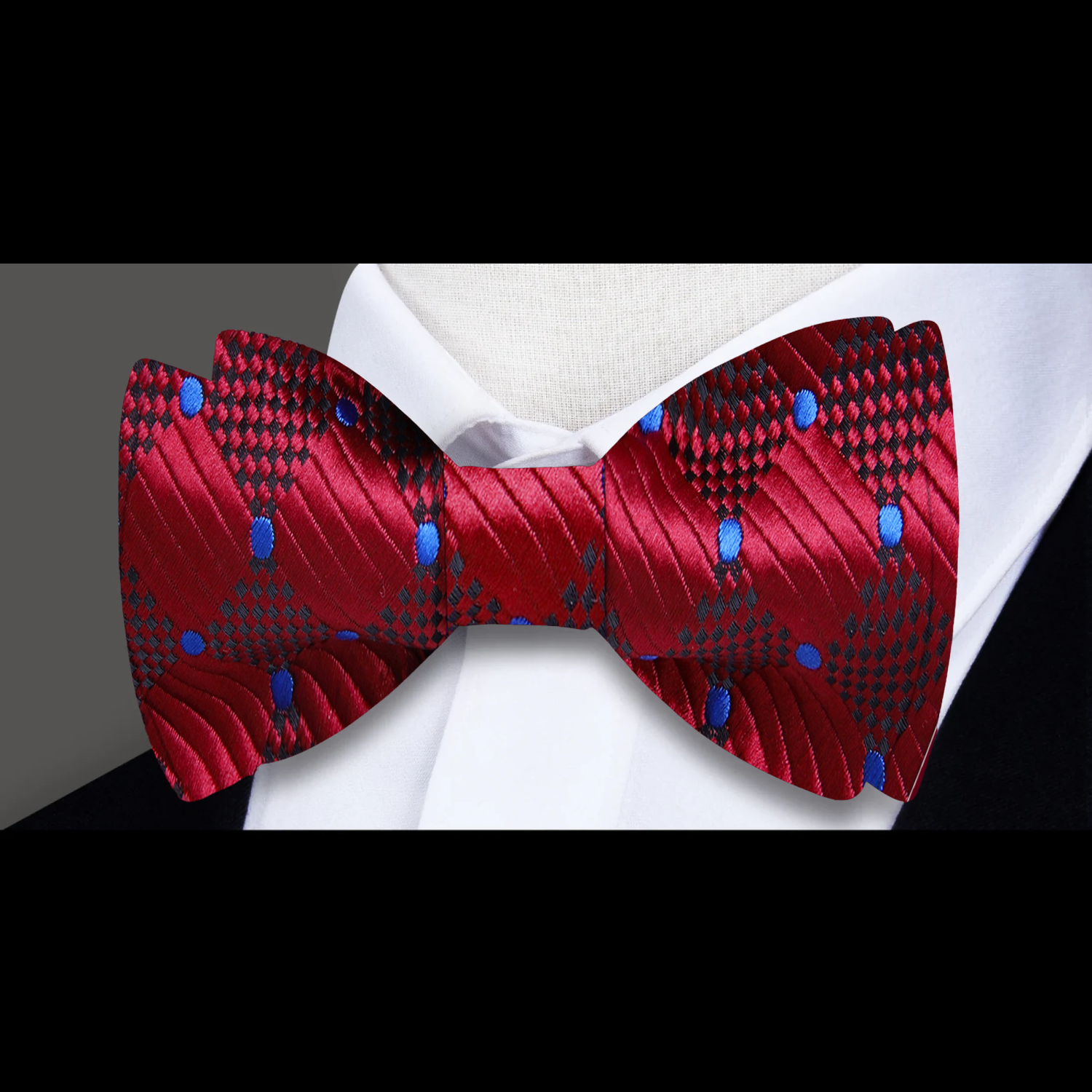 Close-up of deep burgundy and blue geometric pattern bow tie, perfect for black tie events