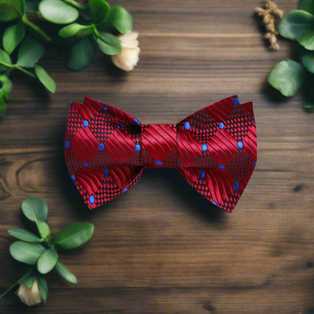 Man wearing a silk bow tie with a matching pocket square for formal wedding attire