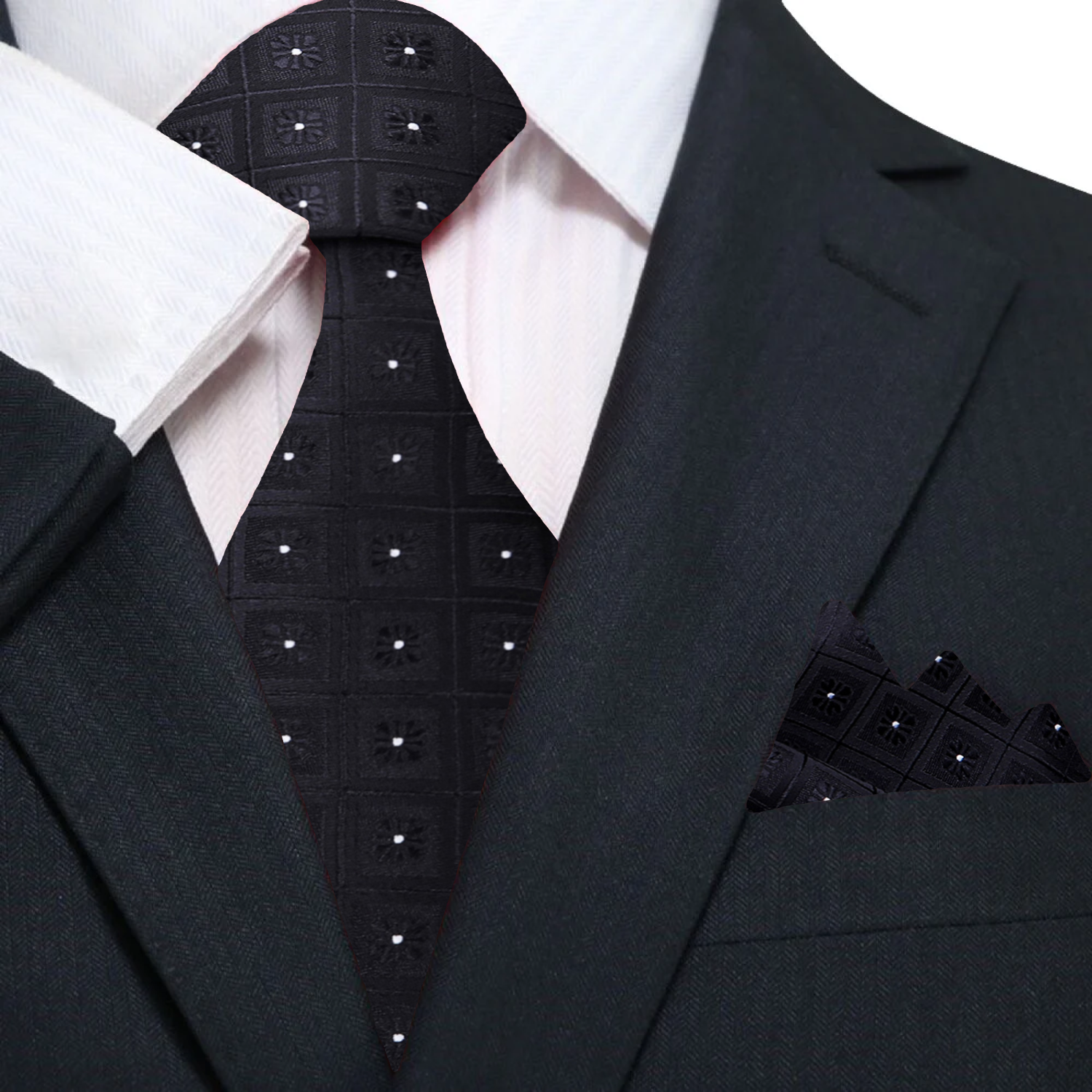 Model showcasing the black geometric necktie paired with a white dress shirt.
